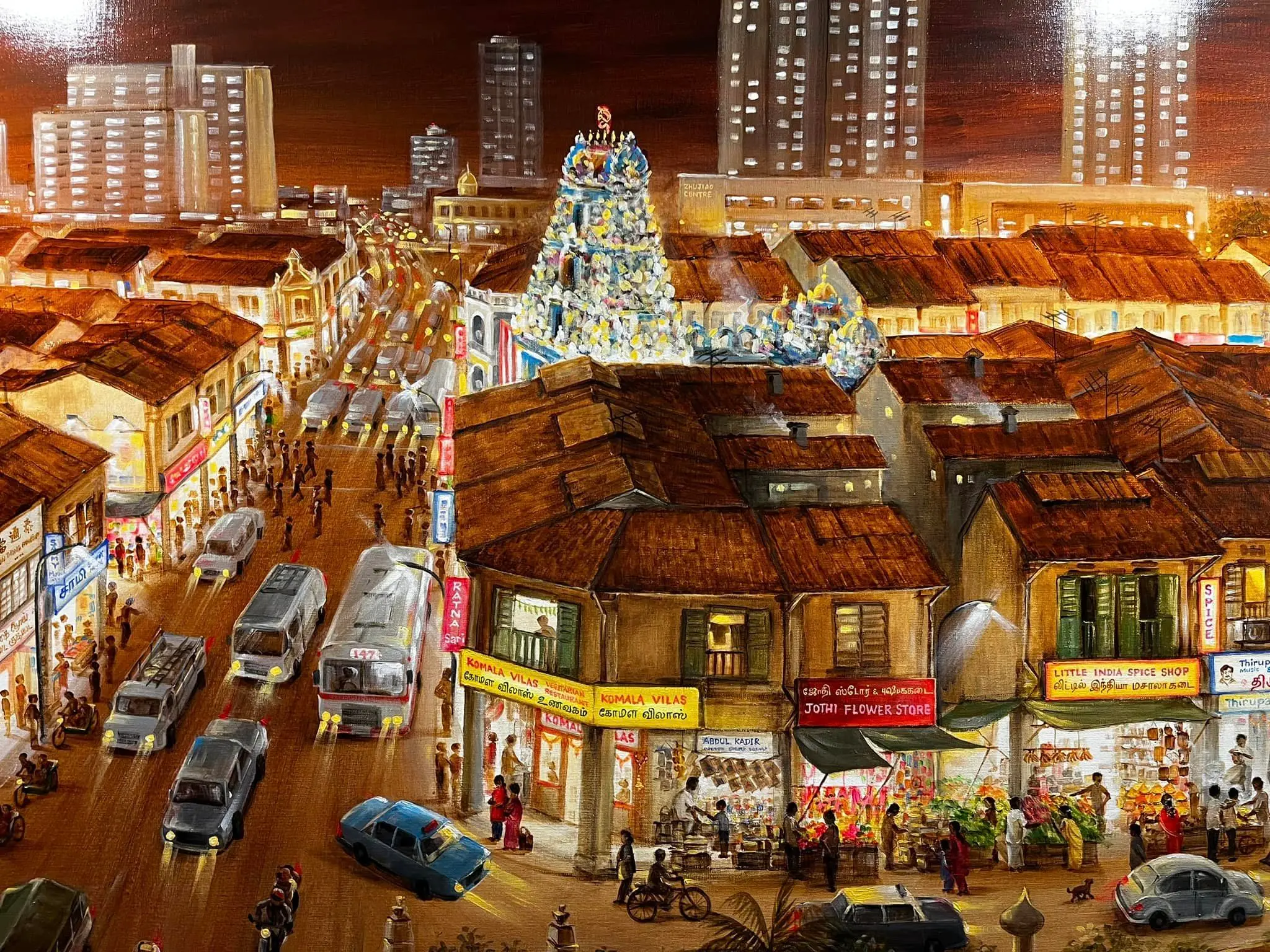 Painting of a bustling Little India street at night with a Hindu temple, shops, buses, and pedestrians.