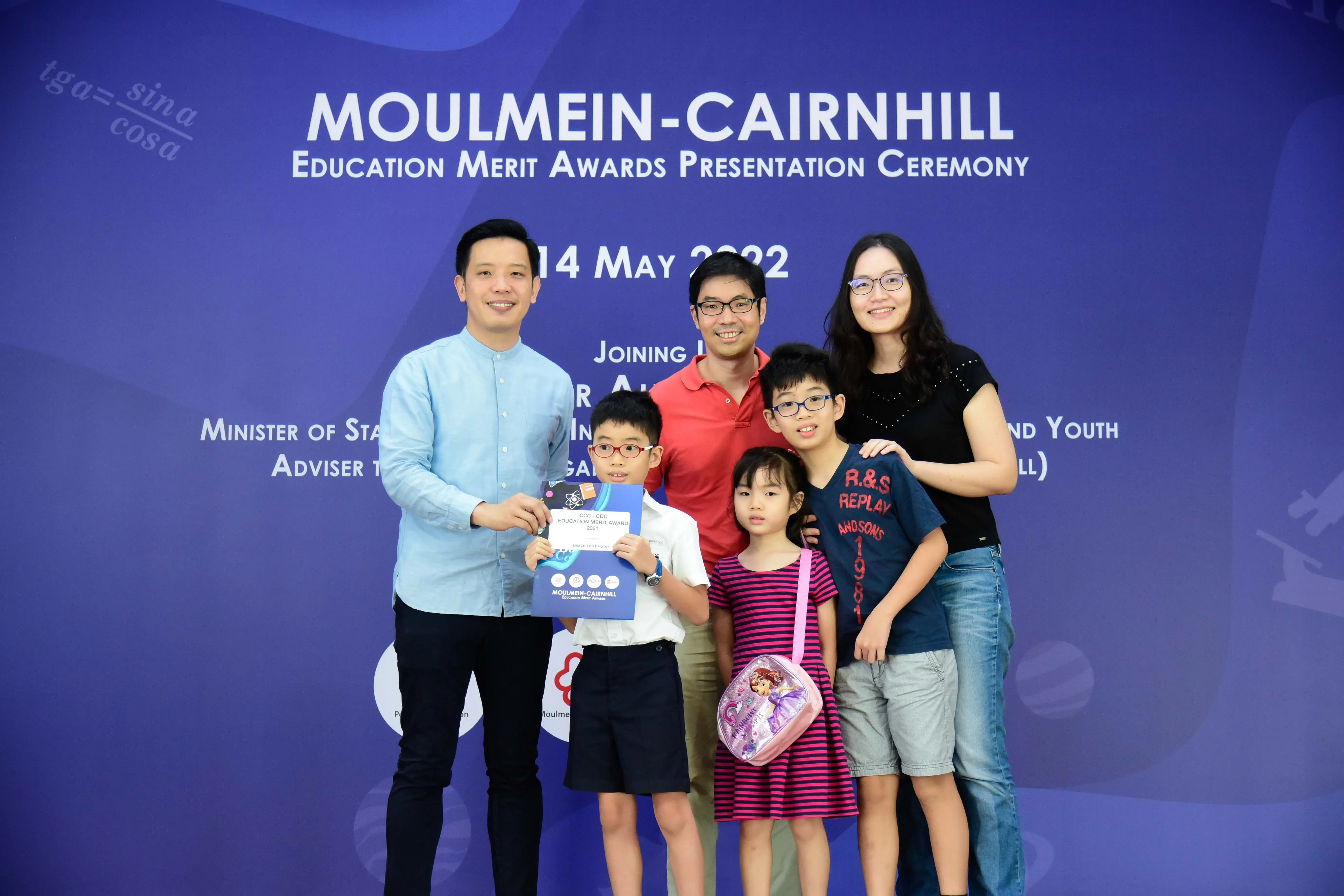 Six people pose at the Moulmein-Cairnhill Education Merit Awards Presentation Ceremony on 14 May 2022.