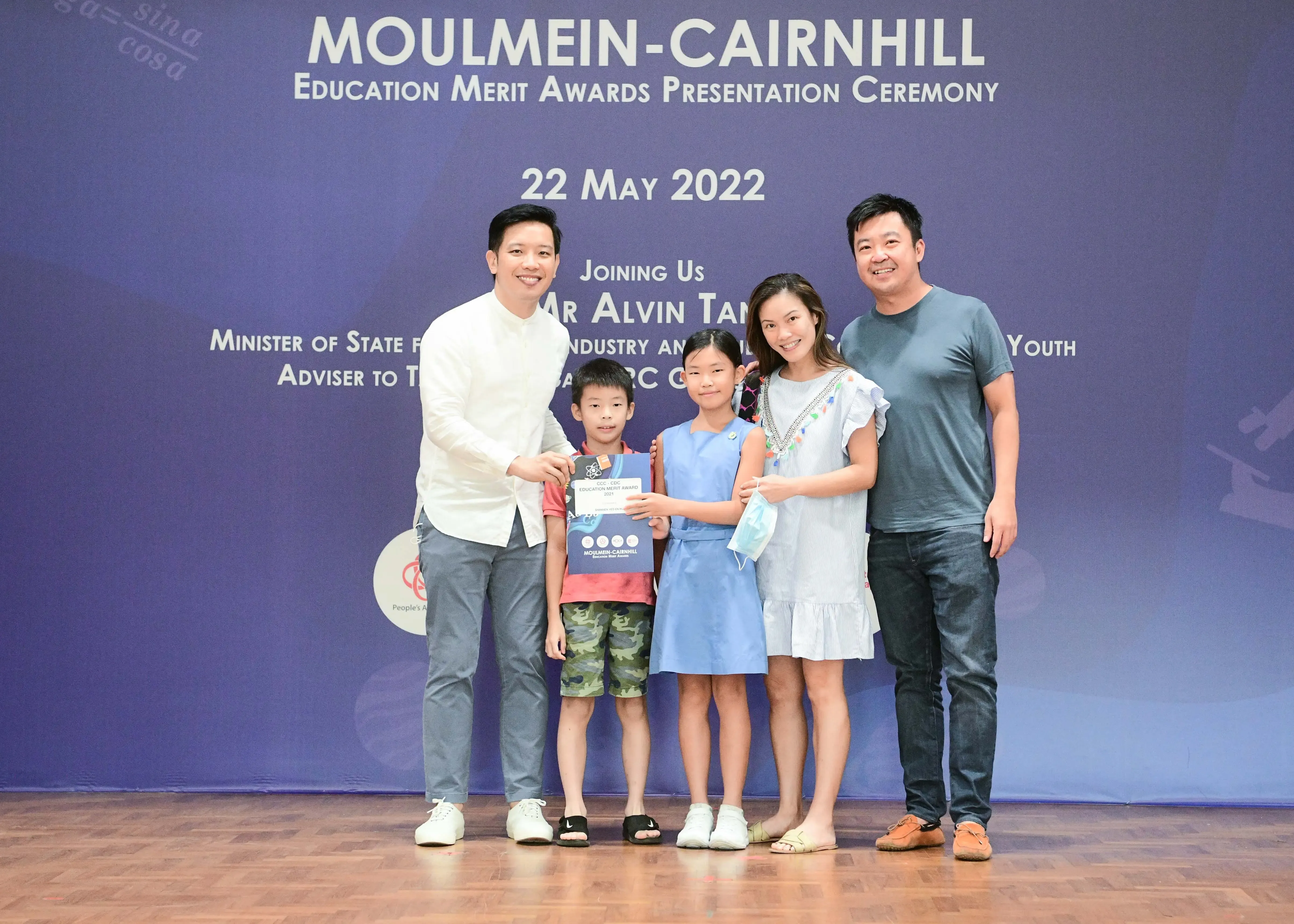 Five people pose at the Moulmein-Cairnhill Education Merit Awards Presentation Ceremony on 22 May 2022.