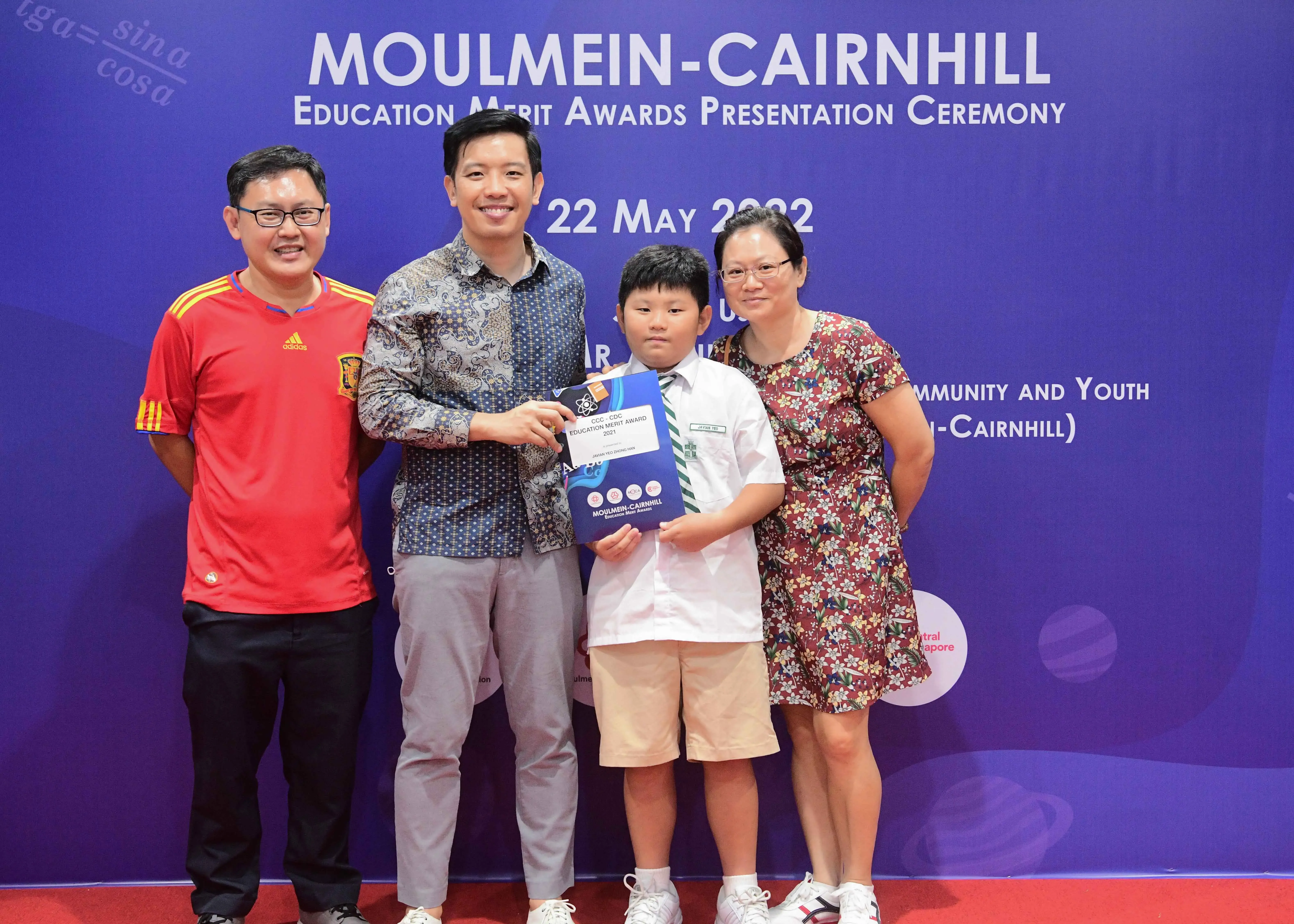 Four people pose at the Moulmein-Cairnhill Education Merit Awards Presentation Ceremony on 22 May 2022.