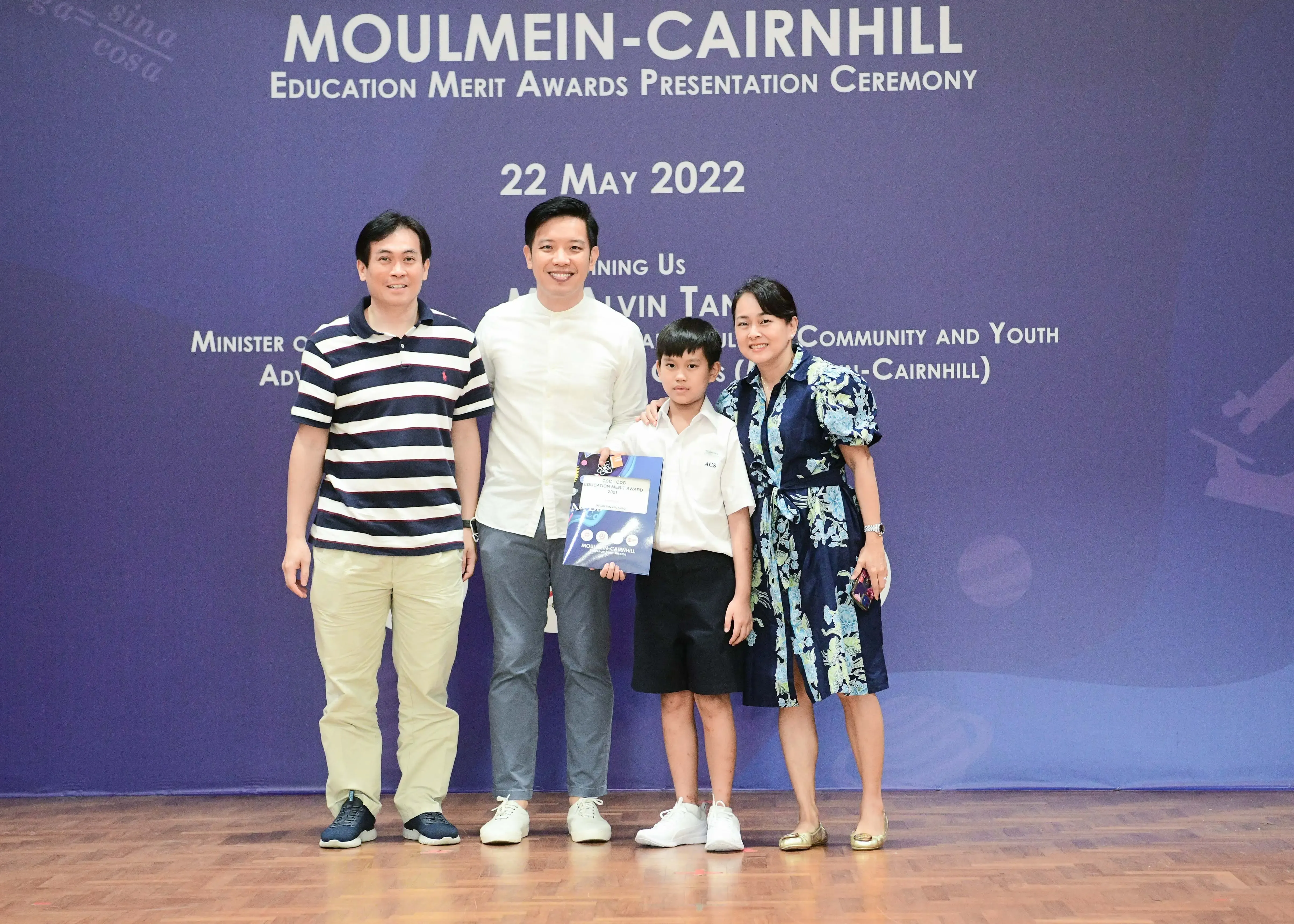 Four people pose at the Moulmein-Cairnhill Education Merit Awards Presentation Ceremony on 22 May 2022.