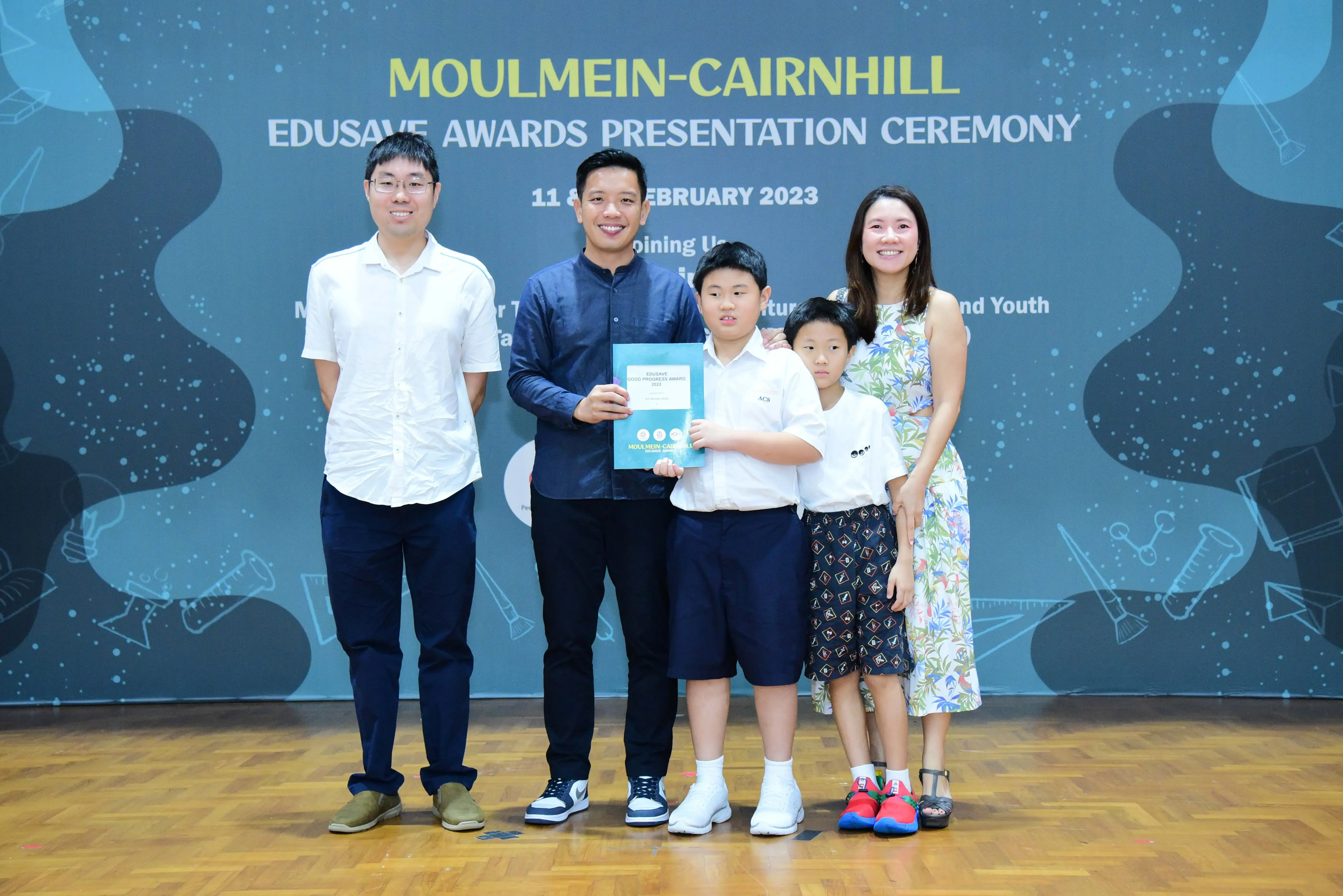 Five people pose at the Moulmein-Cairnhill Edusave Awards Presentation Ceremony on February 11, 2023.