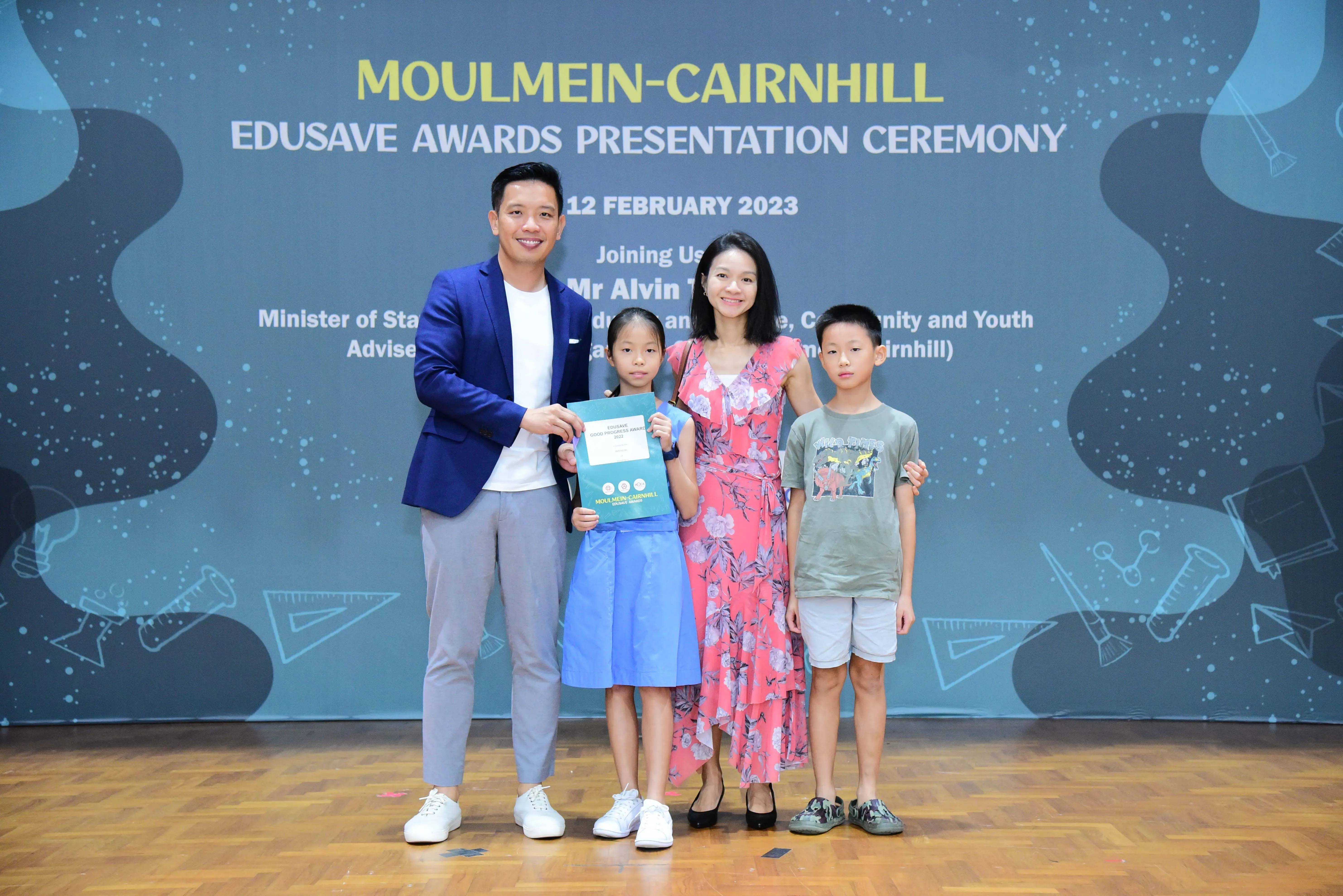 Four people pose at the Moulmein-Cairnhill Edusave Awards Presentation Ceremony on 12 February 2023.