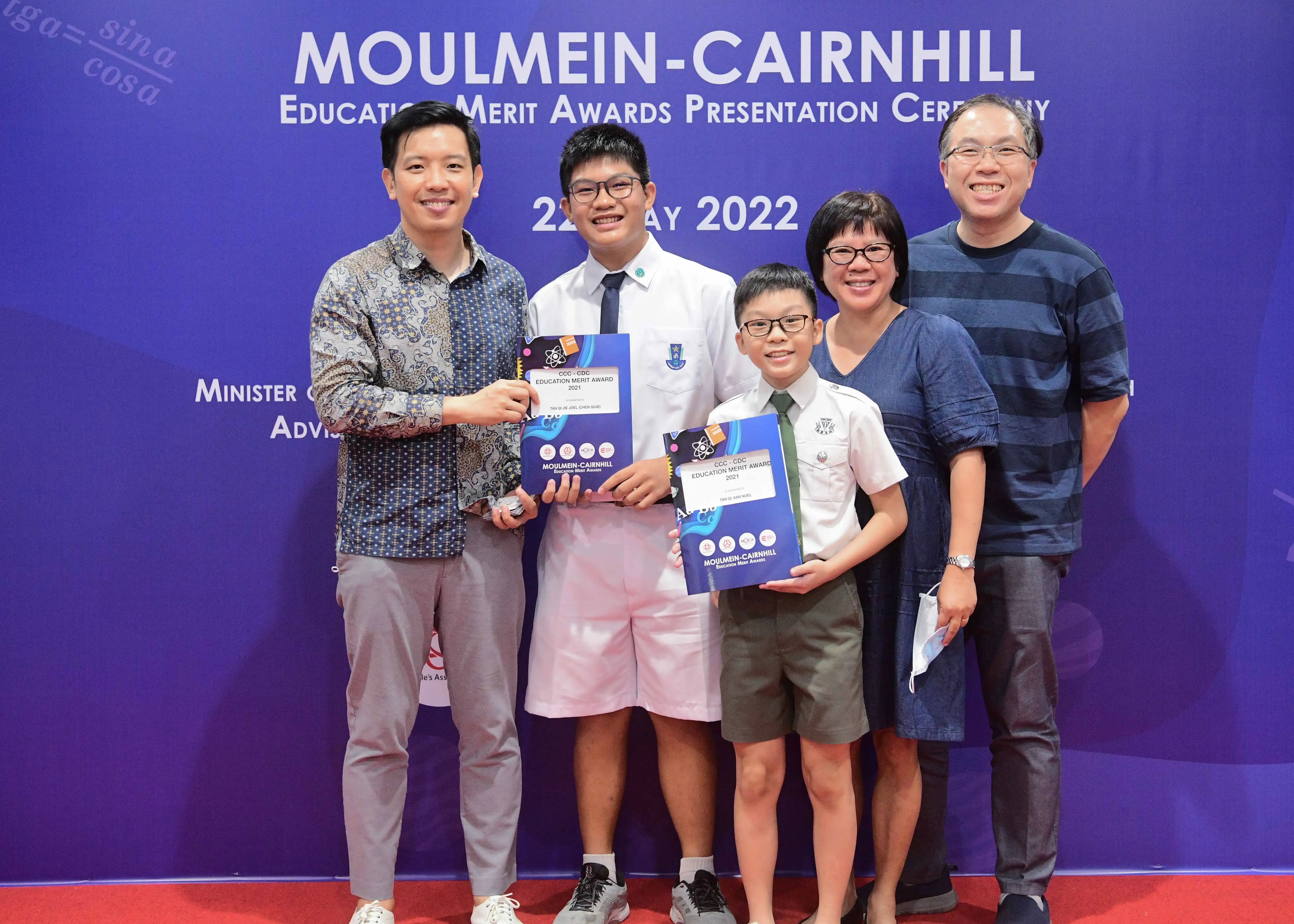Five people pose at the Moulmein-Cairnhill Education Merit Awards Presentation Ceremony on 22 May 2022.