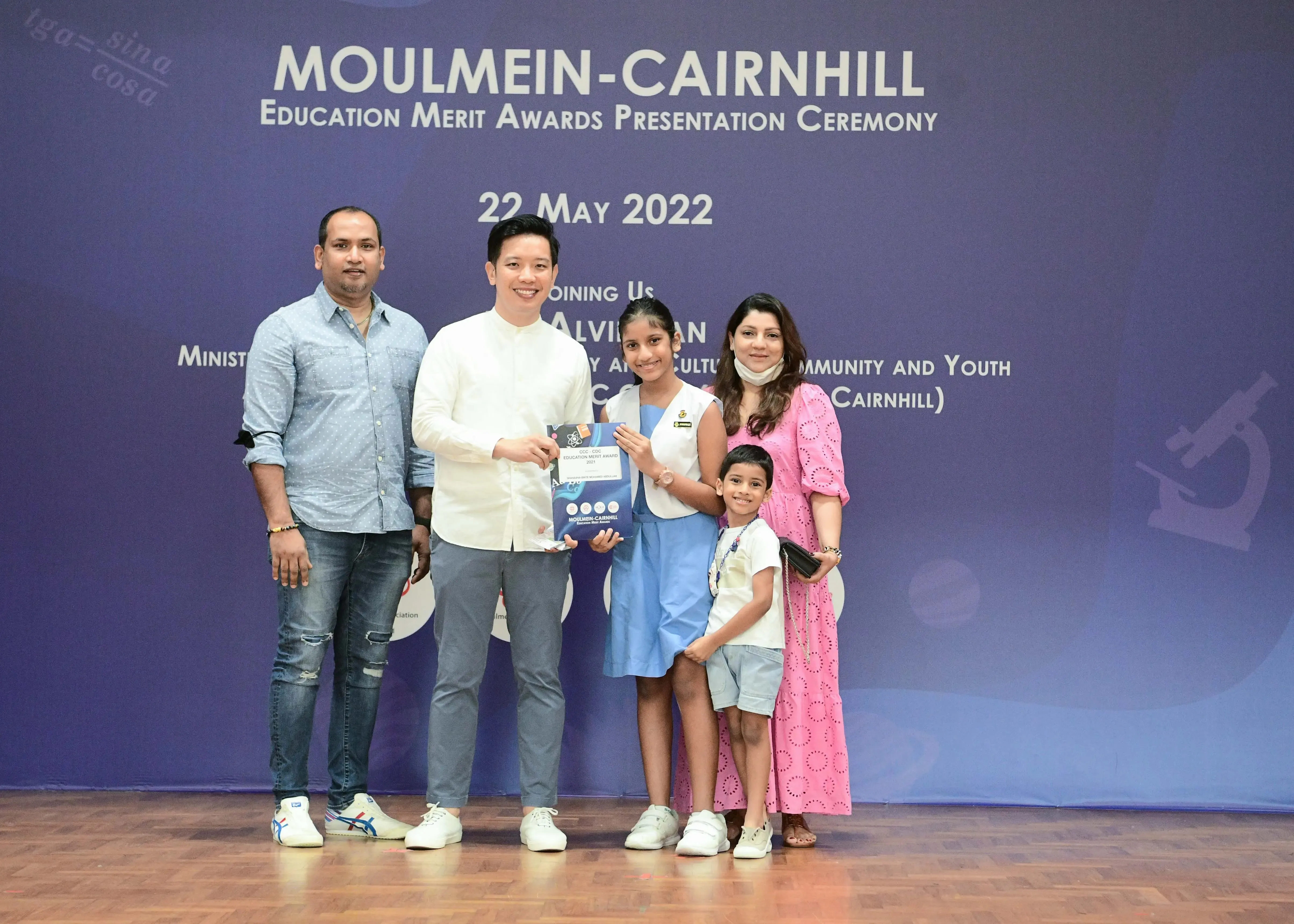 Five people pose at the Moulmein-Cairnhill Education Merit Awards Presentation Ceremony on 22 May 2022.