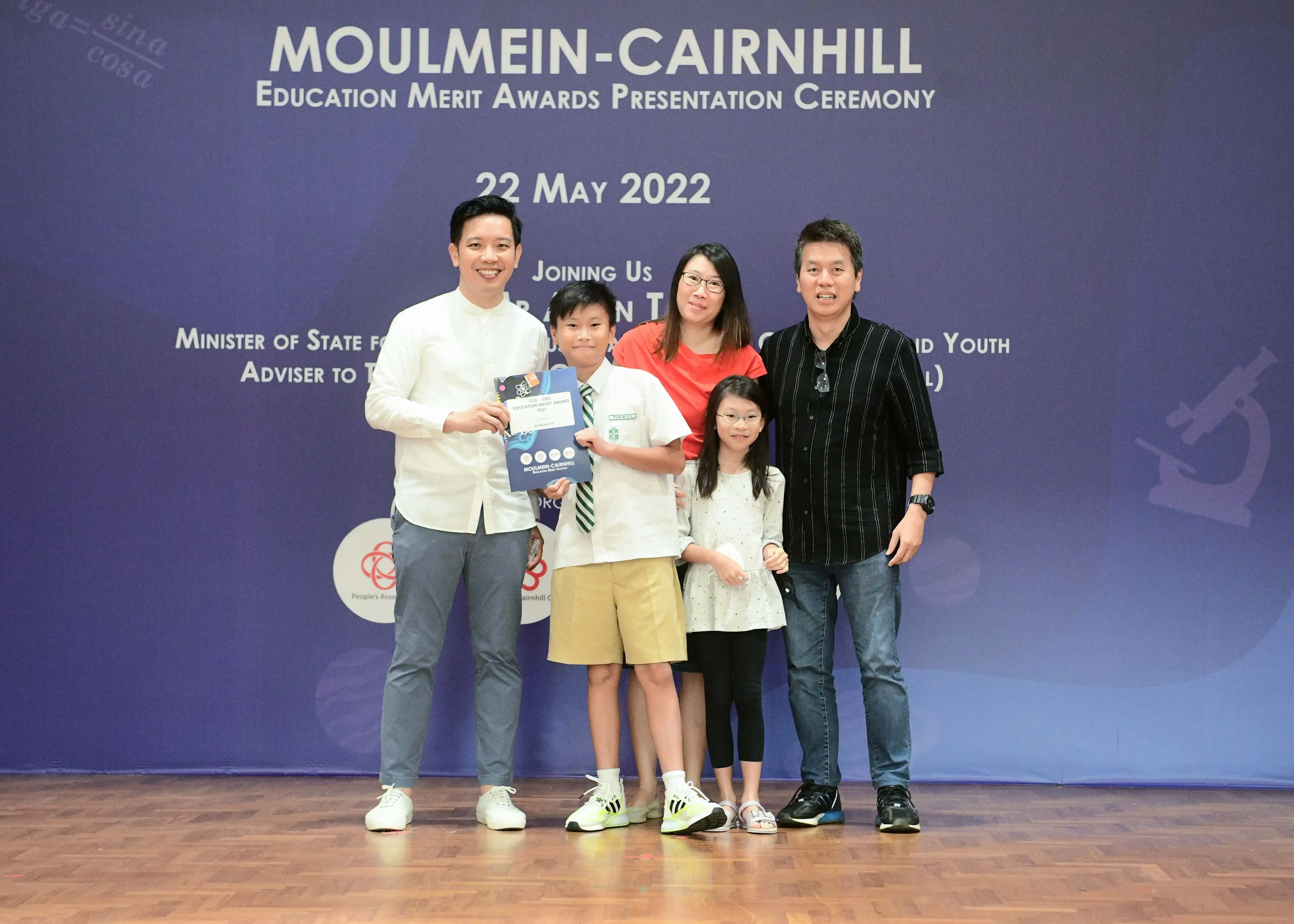 Five people pose at the Moulmein-Cairnhill Education Merit Awards Presentation Ceremony on 22 May 2022.