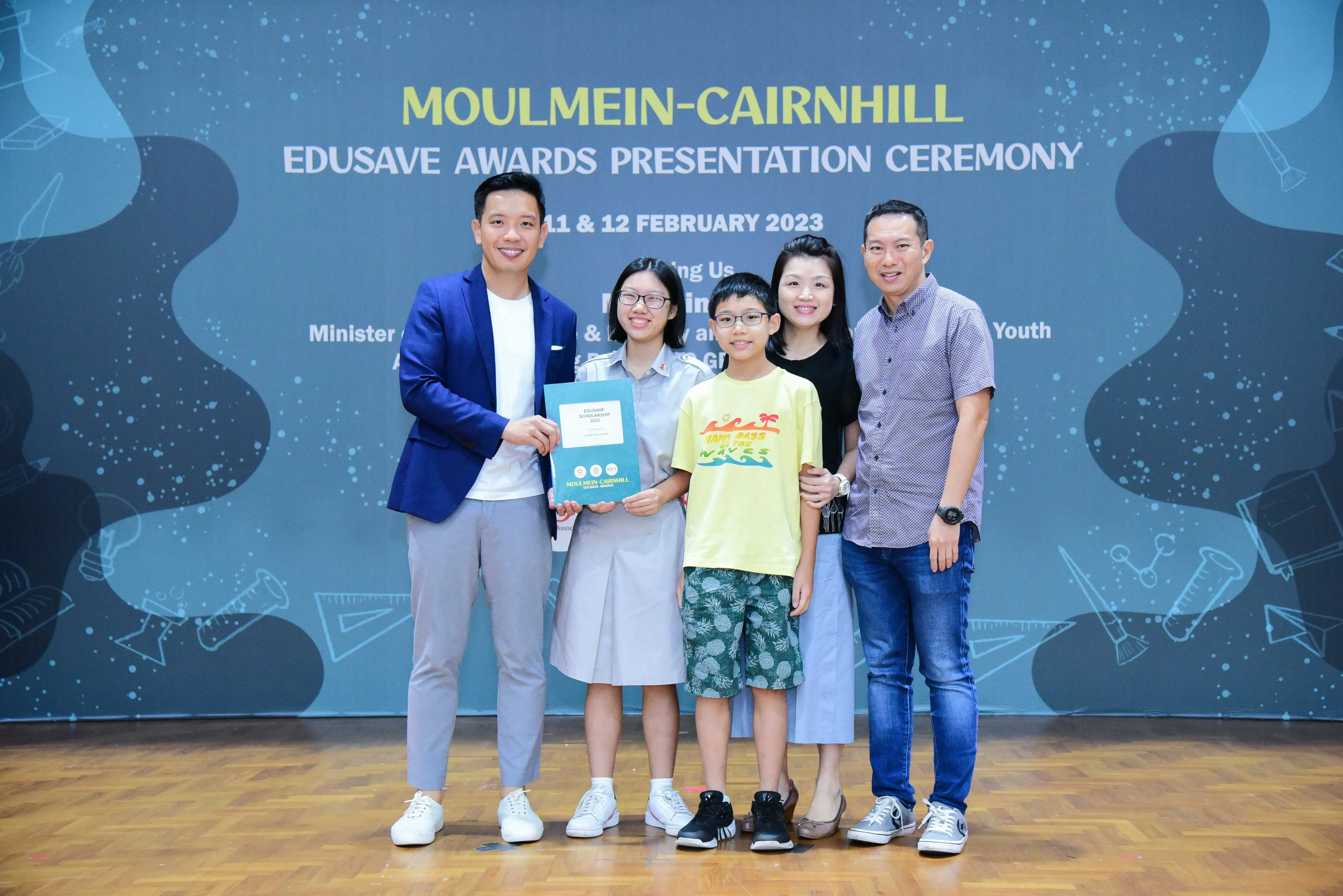 Five people pose together at the Moulmein-Cairnhill Edusave Awards Presentation Ceremony on February 11-12, 2023.
