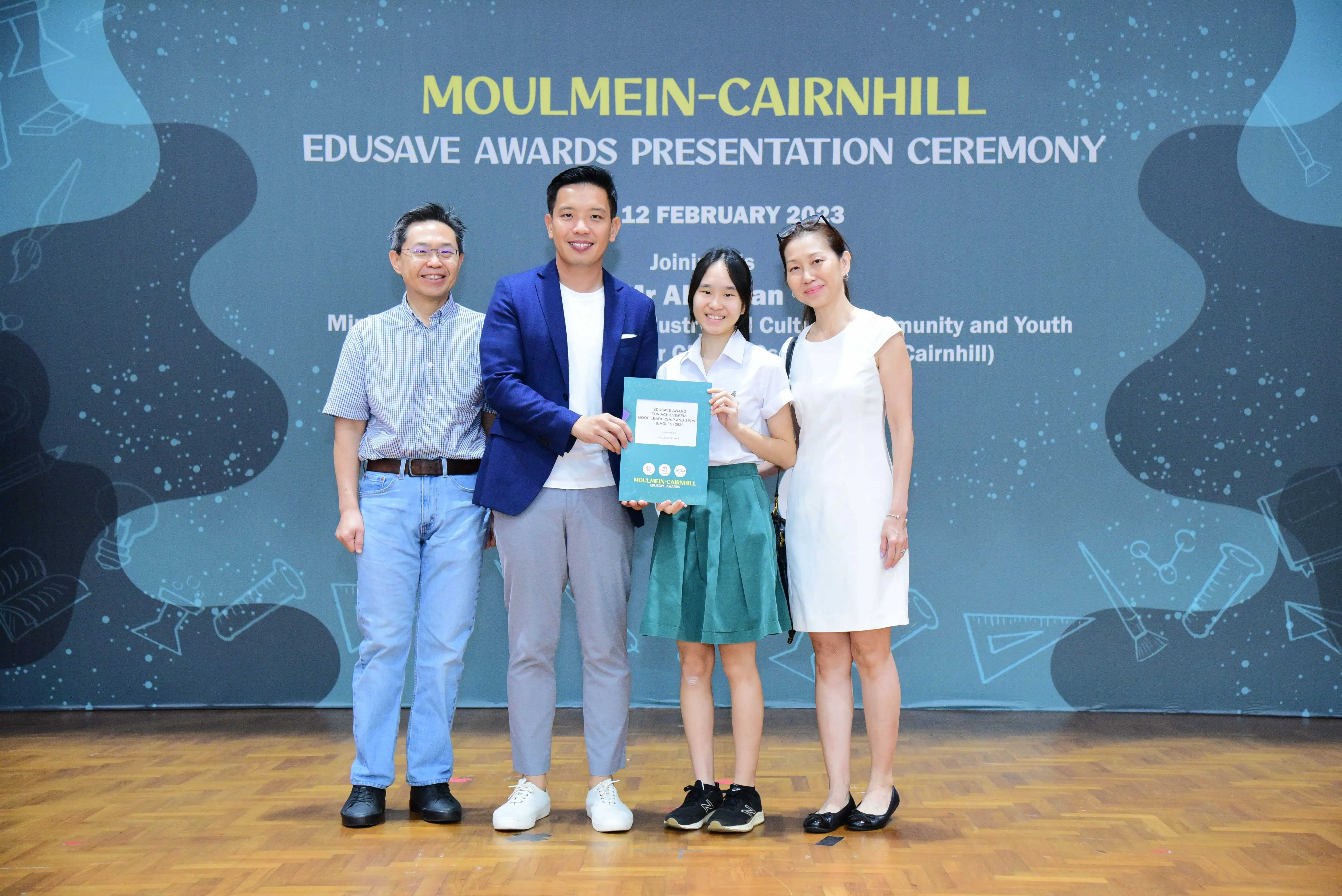 Four people pose at the Moulmein-Cairnhill Edusave Awards Presentation Ceremony on 12 February 2023.