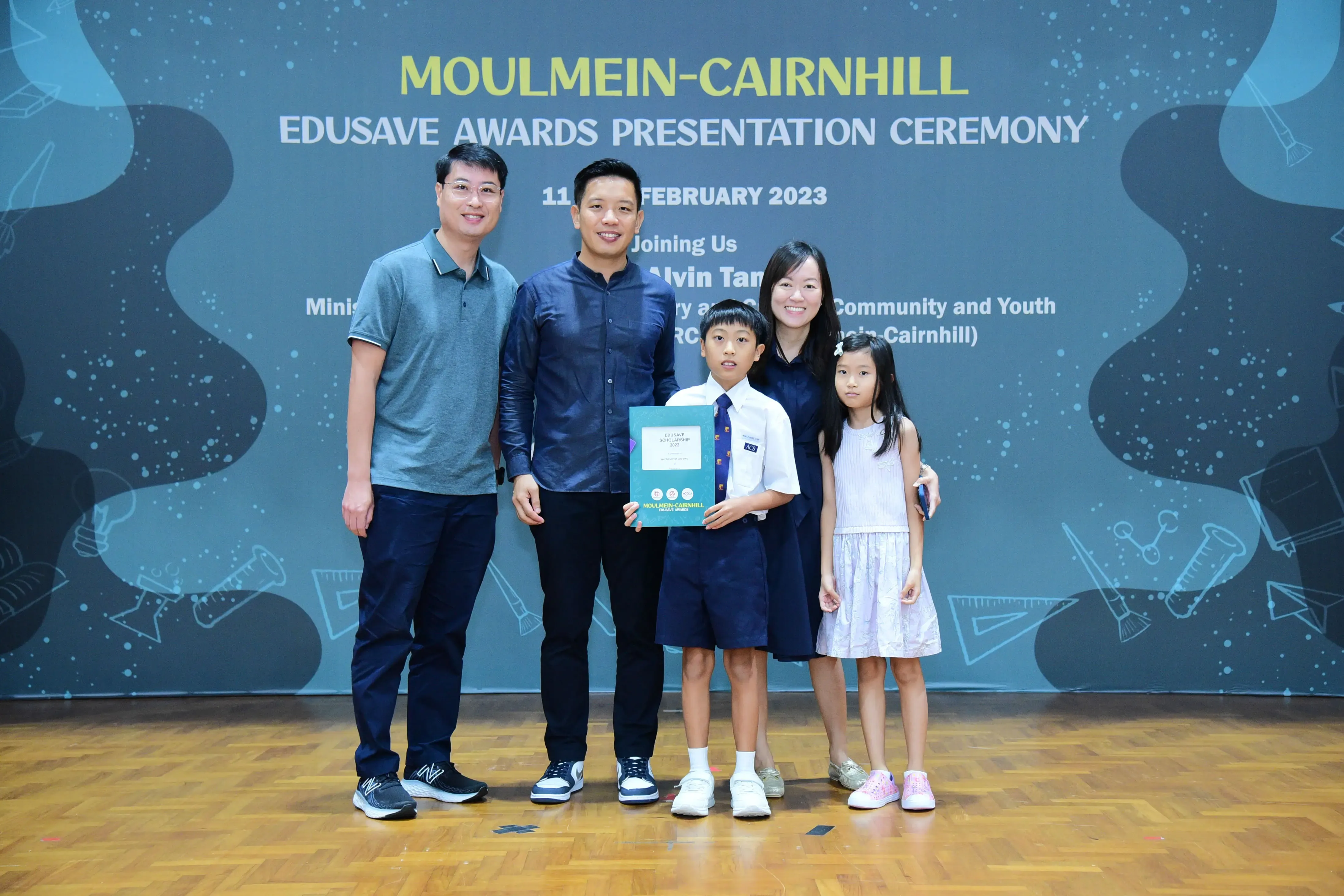 Five people pose at the Moulmein-Cairnhill Edusave Awards Presentation Ceremony on 11 February 2023.
