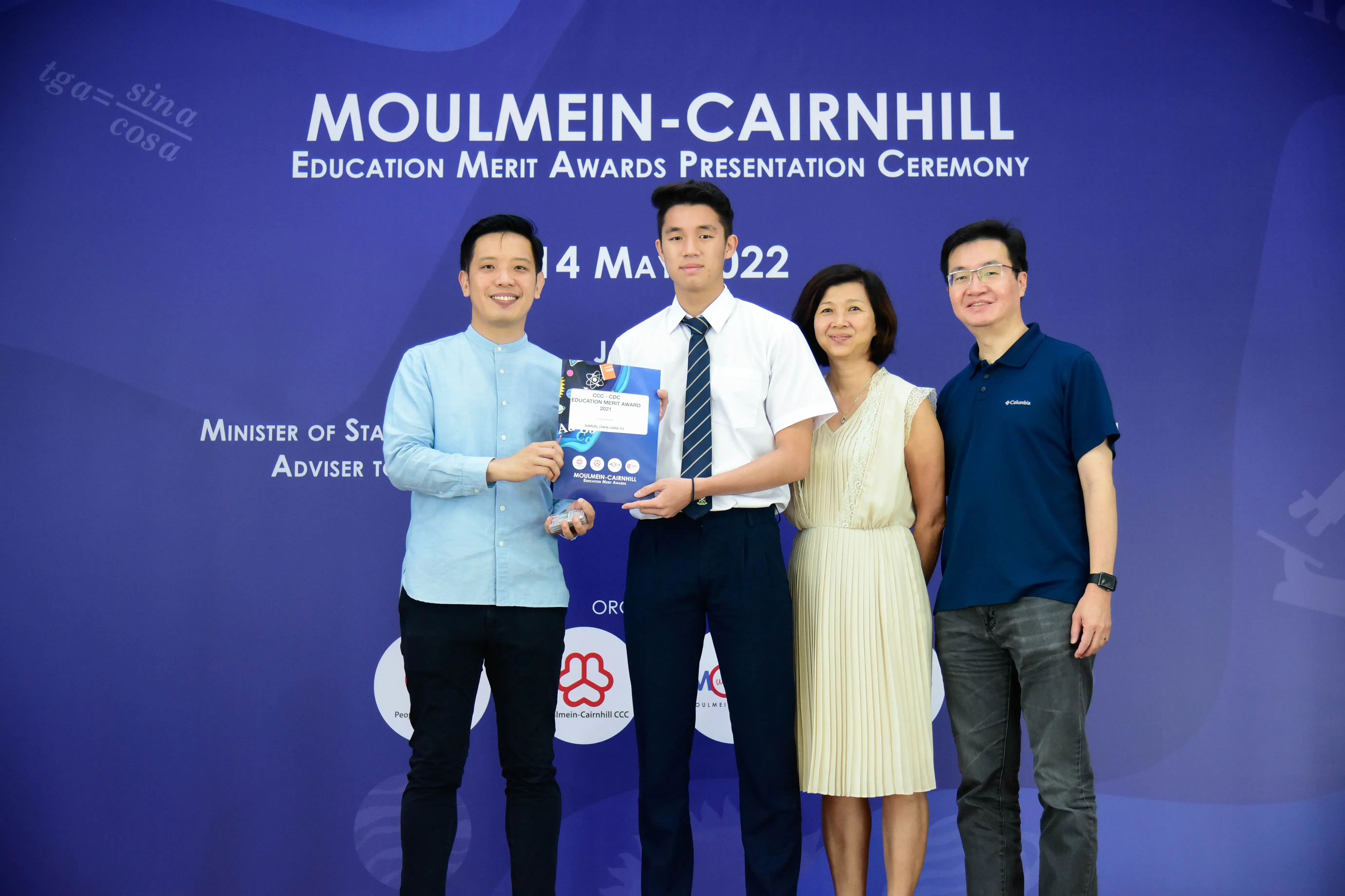 Four people pose at the Moulmein-Cairnhill Education Merit Awards Presentation Ceremony on 14 May 2022.