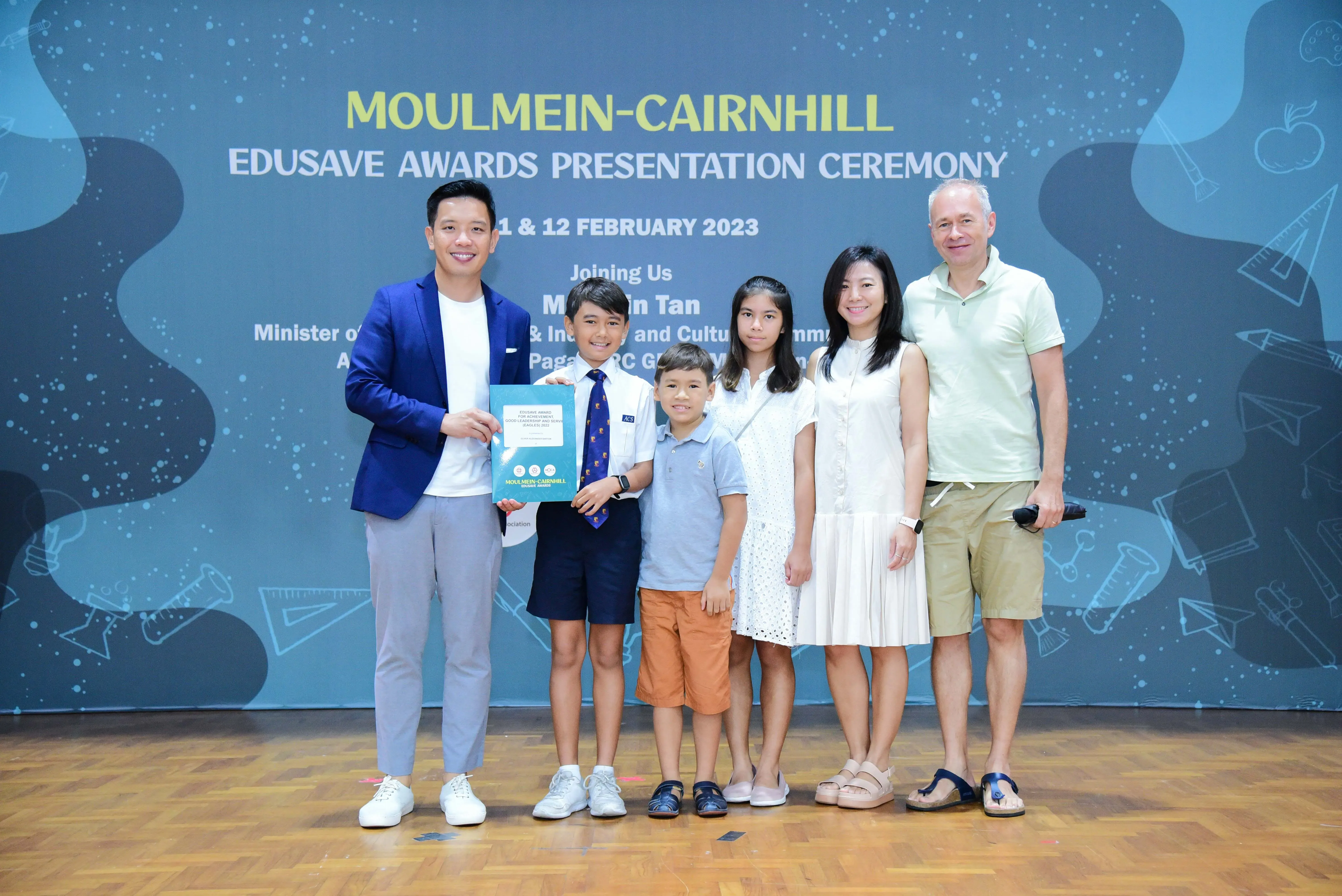 Six people pose at the Moulmein-Cairnhill Edusave Awards Presentation Ceremony on February 2023.