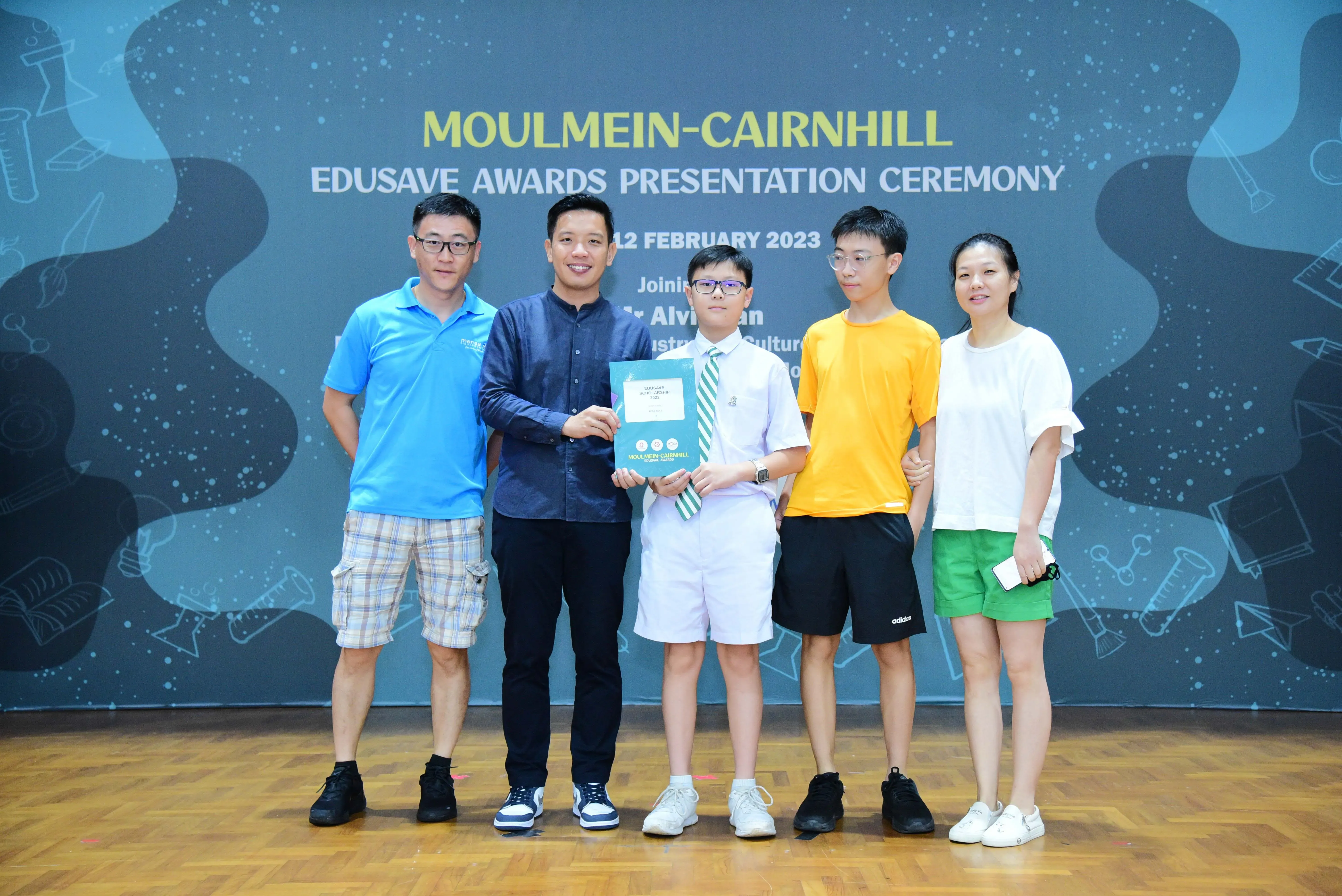 Five people pose at the Moulmein-Cairnhill Edusave Awards Presentation Ceremony on 12 February 2023.