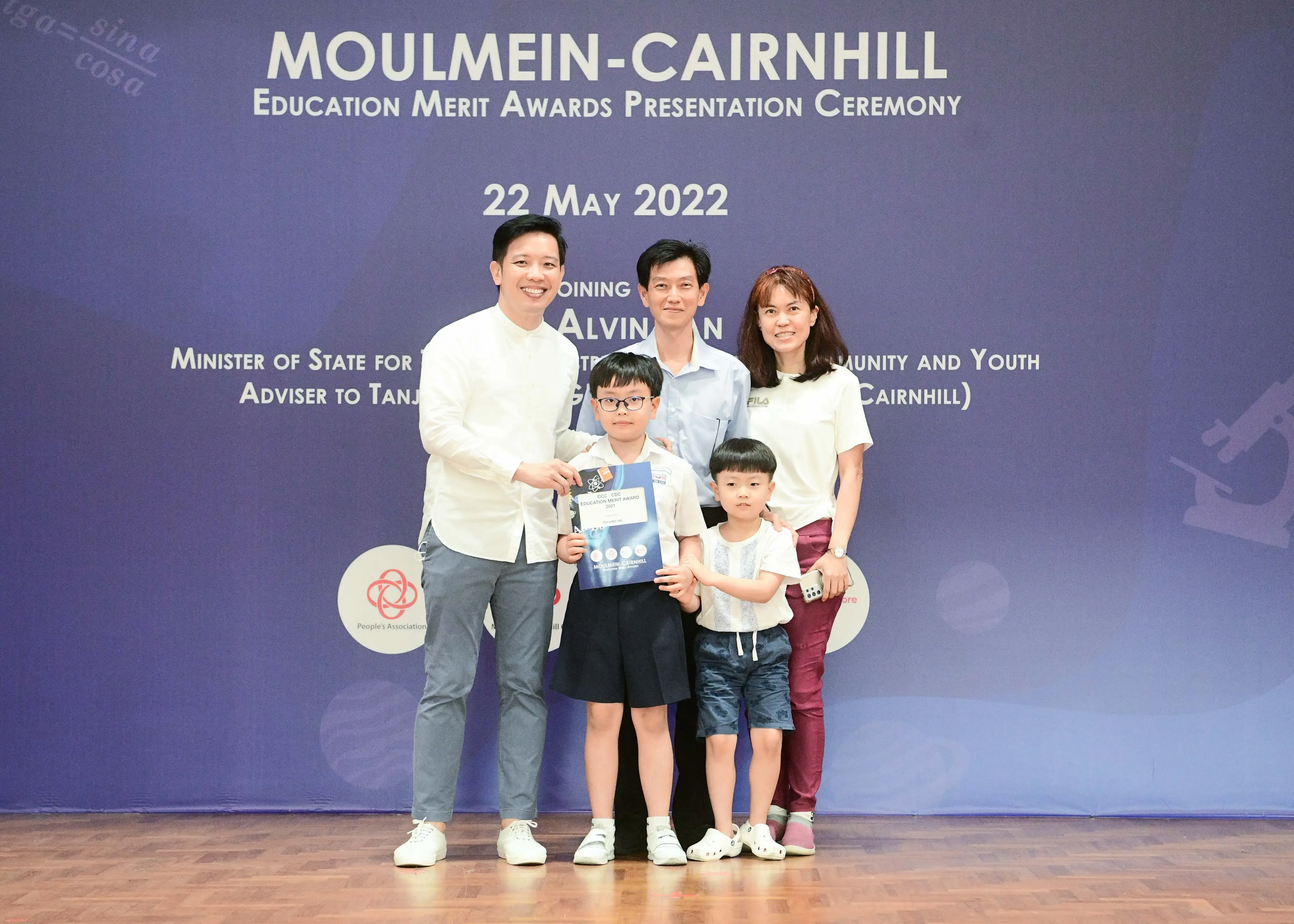 Five people pose at the Moulmein-Cairnhill Education Merit Awards Ceremony on 22 May 2022.