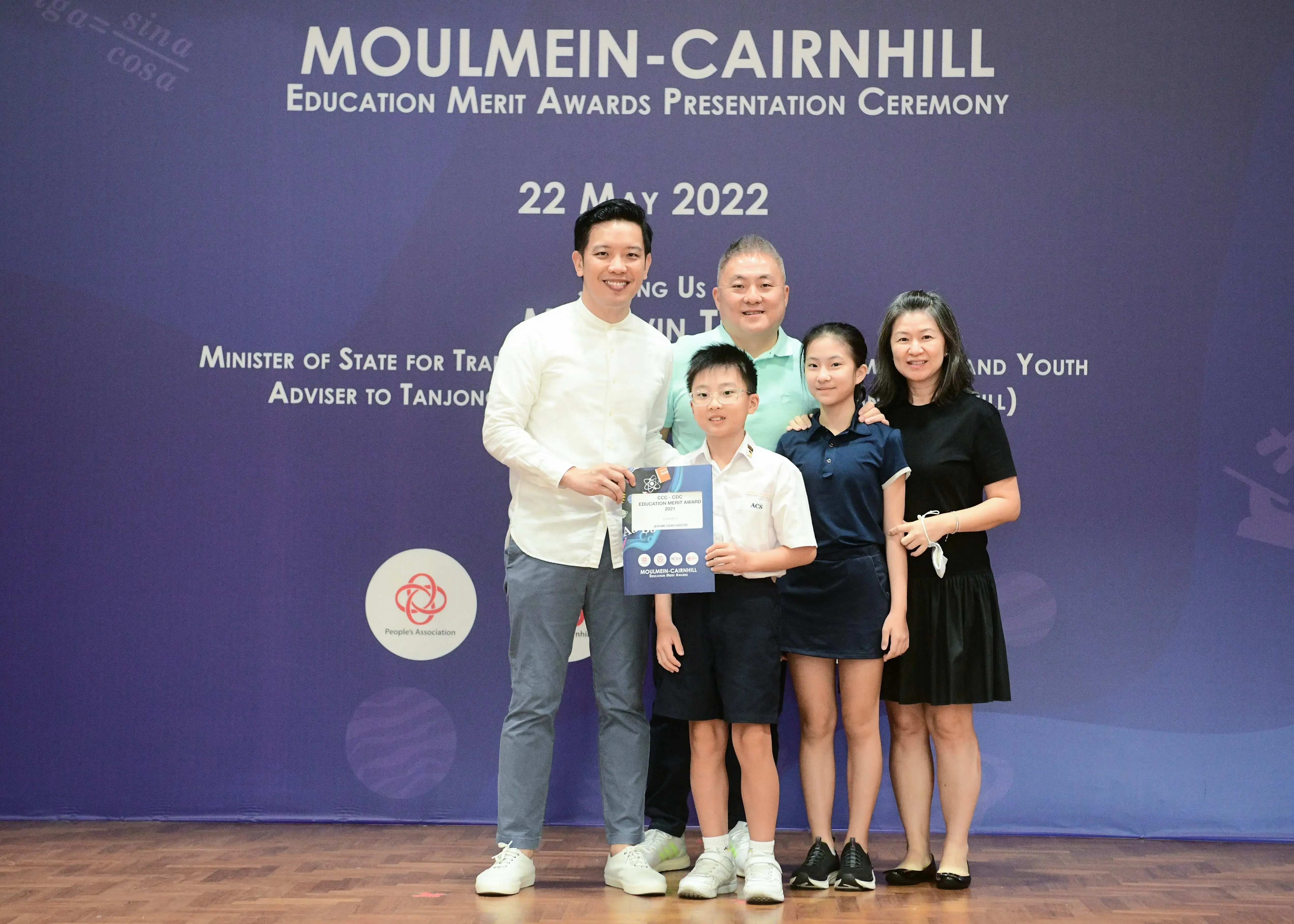 Five people pose at the Moulmein-Cairnhill Education Merit Awards Presentation Ceremony on 22 May 2022.