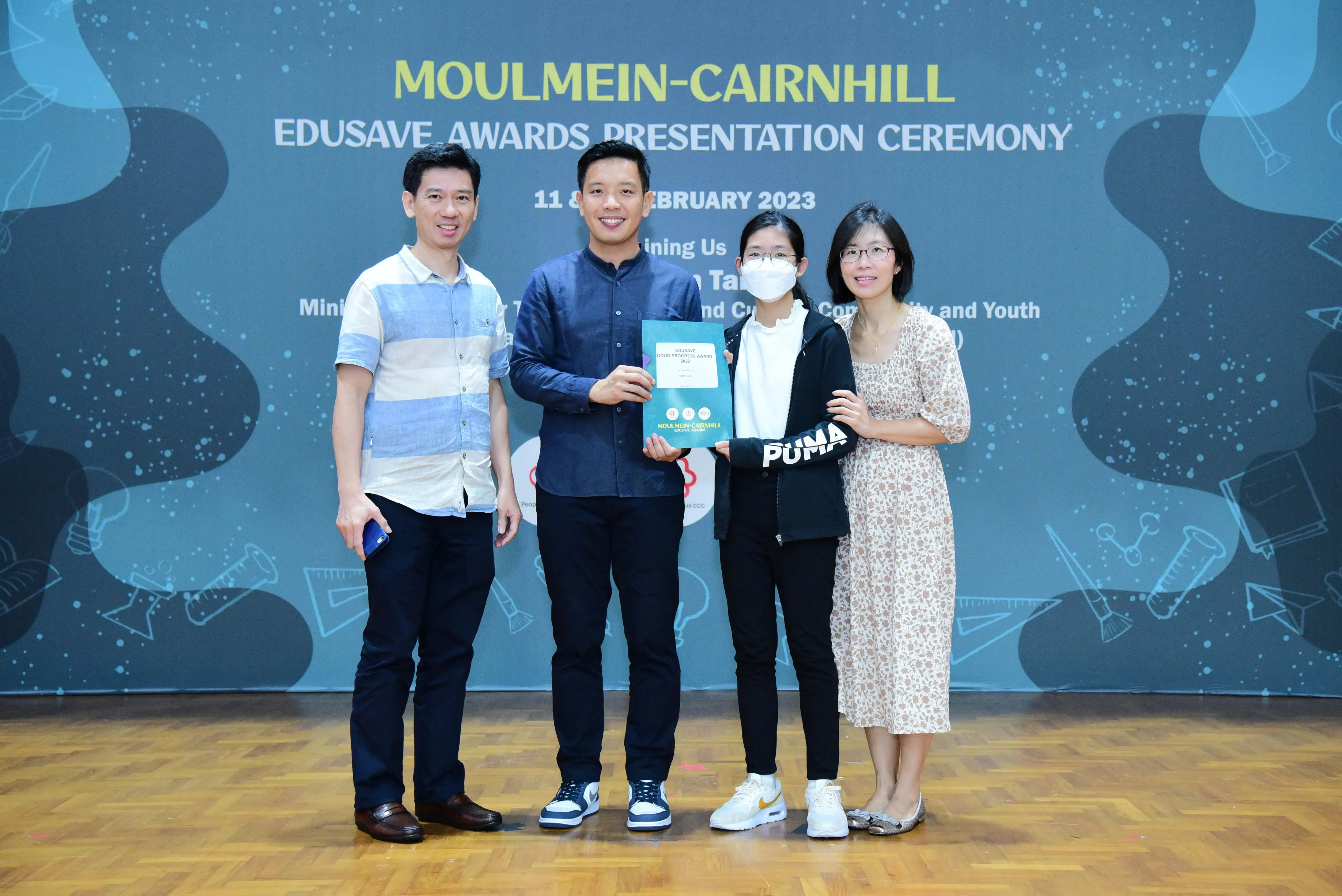 Four people pose at the Moulmein-Cairnhill Edusave Awards Presentation Ceremony on 11 February 2023.