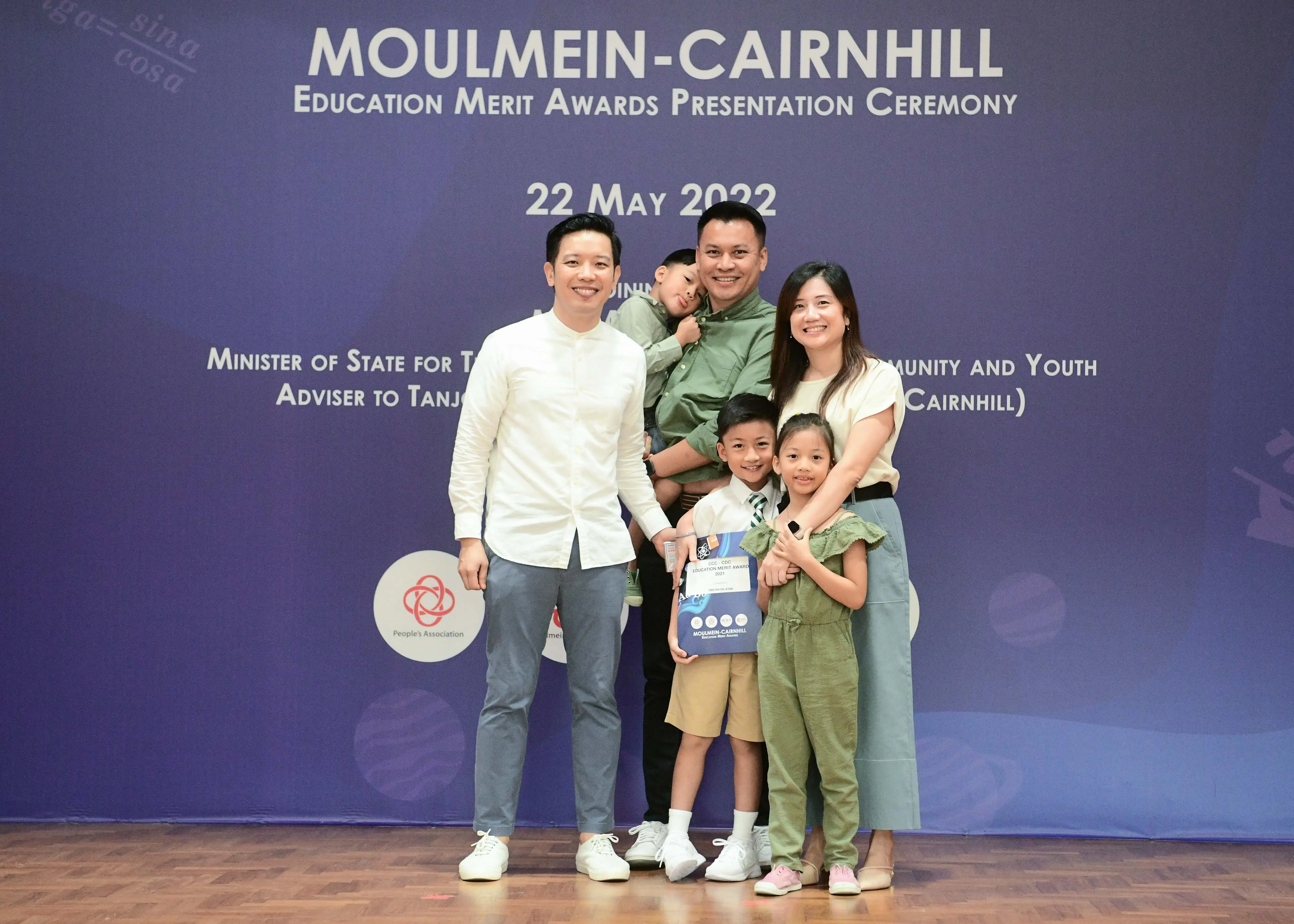 Family of five posing at the Moulmein-Cairnhill Education Merit Awards ceremony on 22 May 2022.