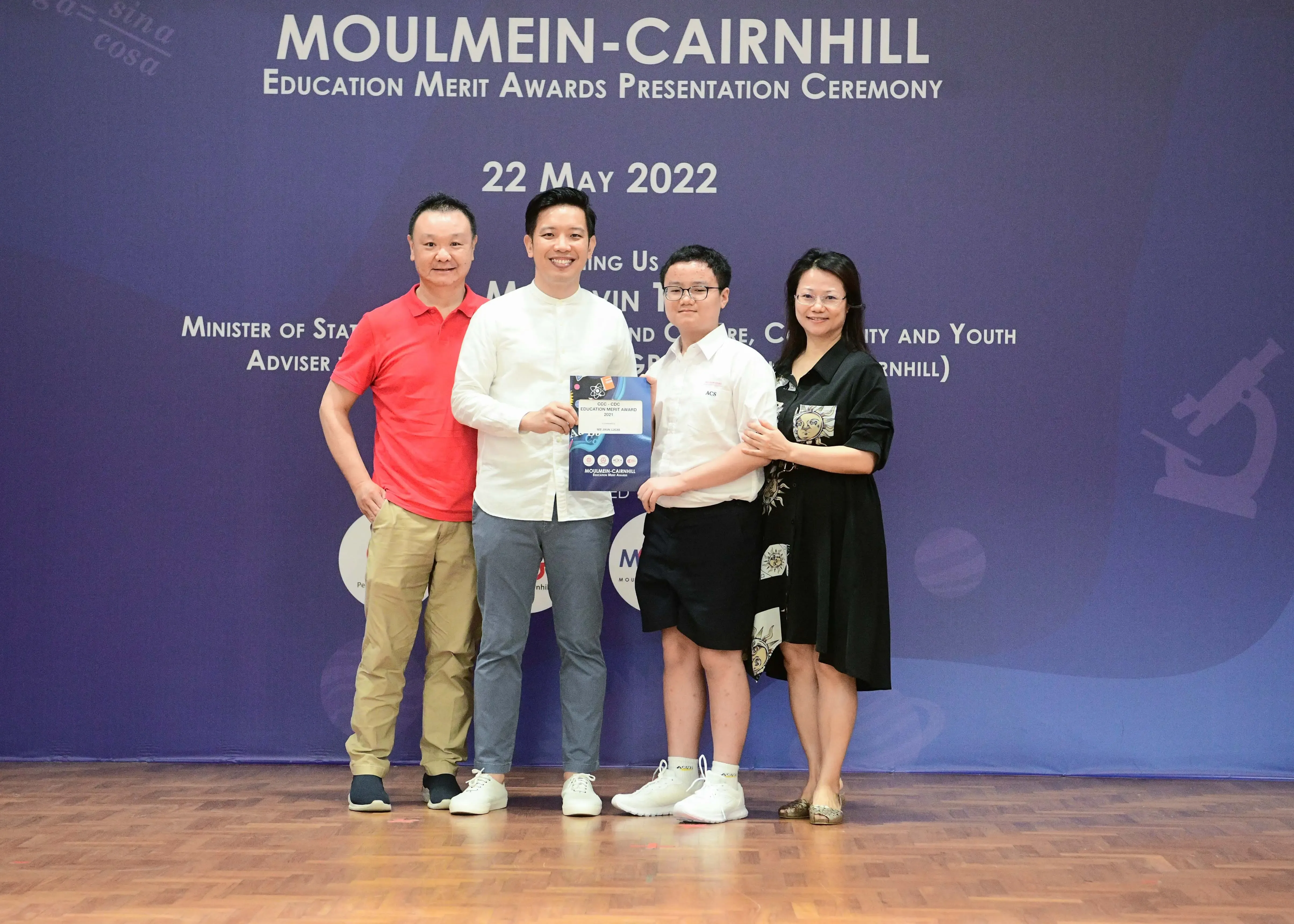 Four people pose at the Moulmein-Cairnhill Education Merit Awards Presentation Ceremony on 22 May 2022.