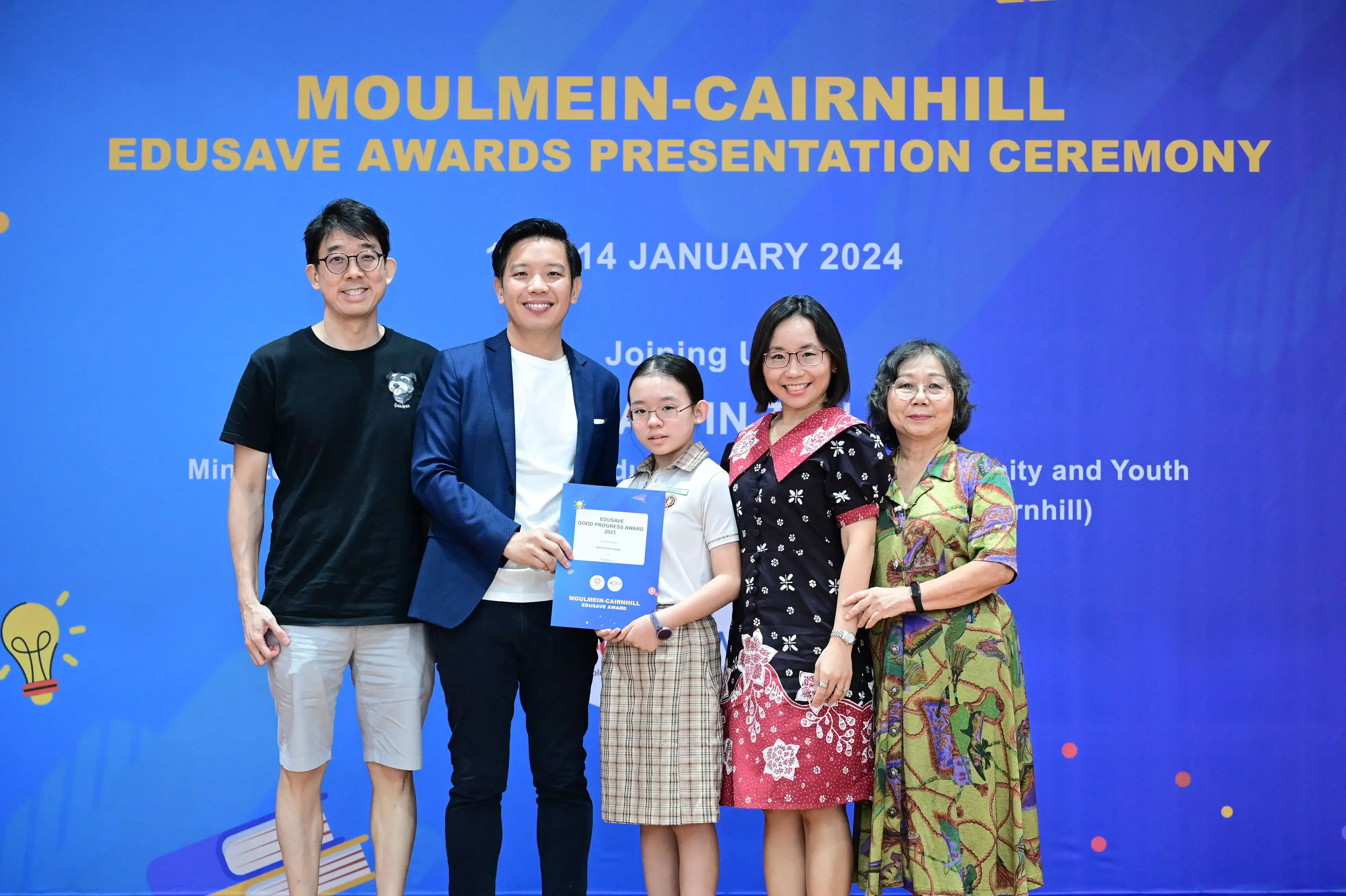 Five people pose at the Moulmein-Cairnhill Edusave Awards Presentation Ceremony on 14 January 2024.