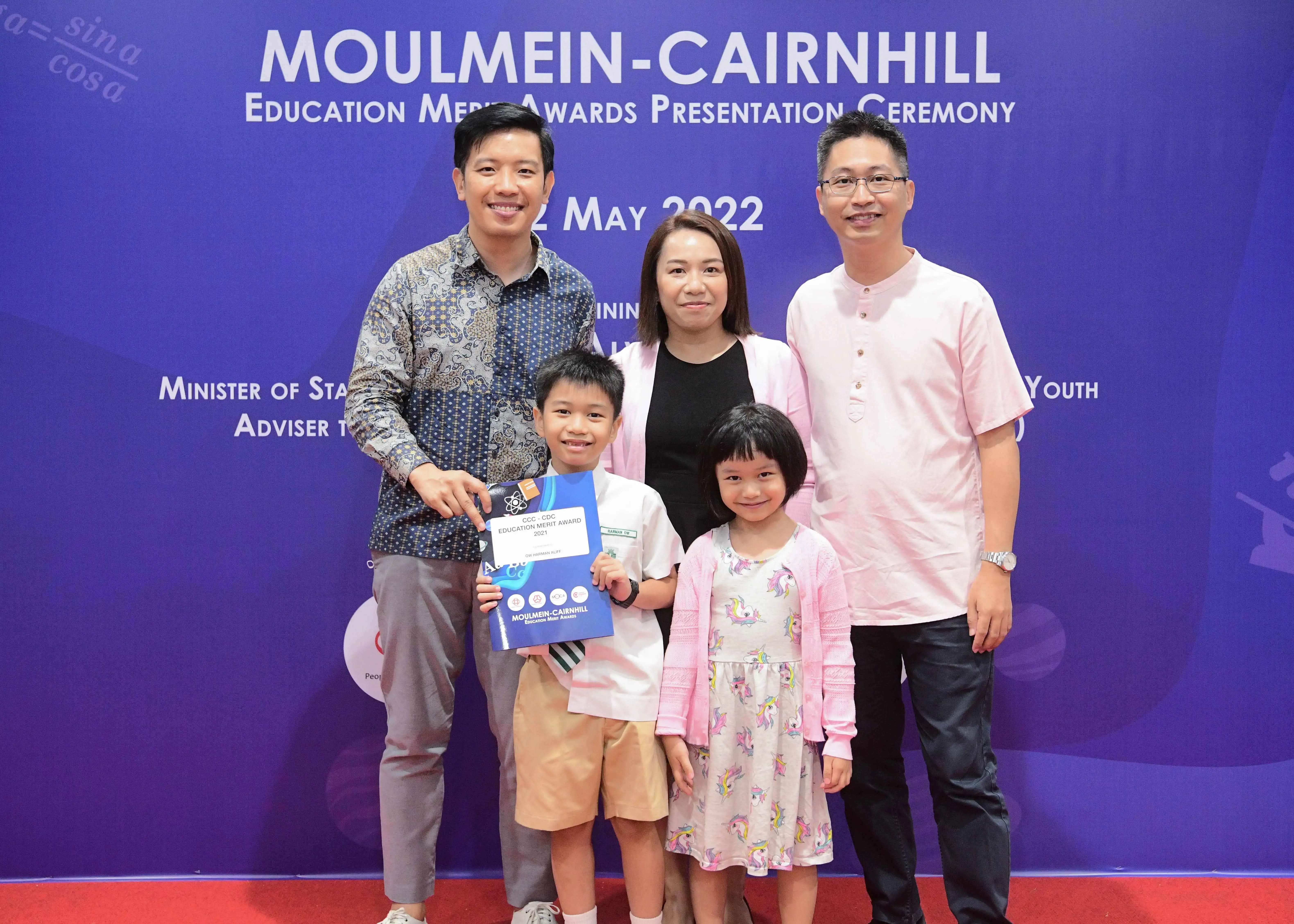 Five people pose at the Moulmein-Cairnhill Education Merit Awards Presentation Ceremony on May 2022.