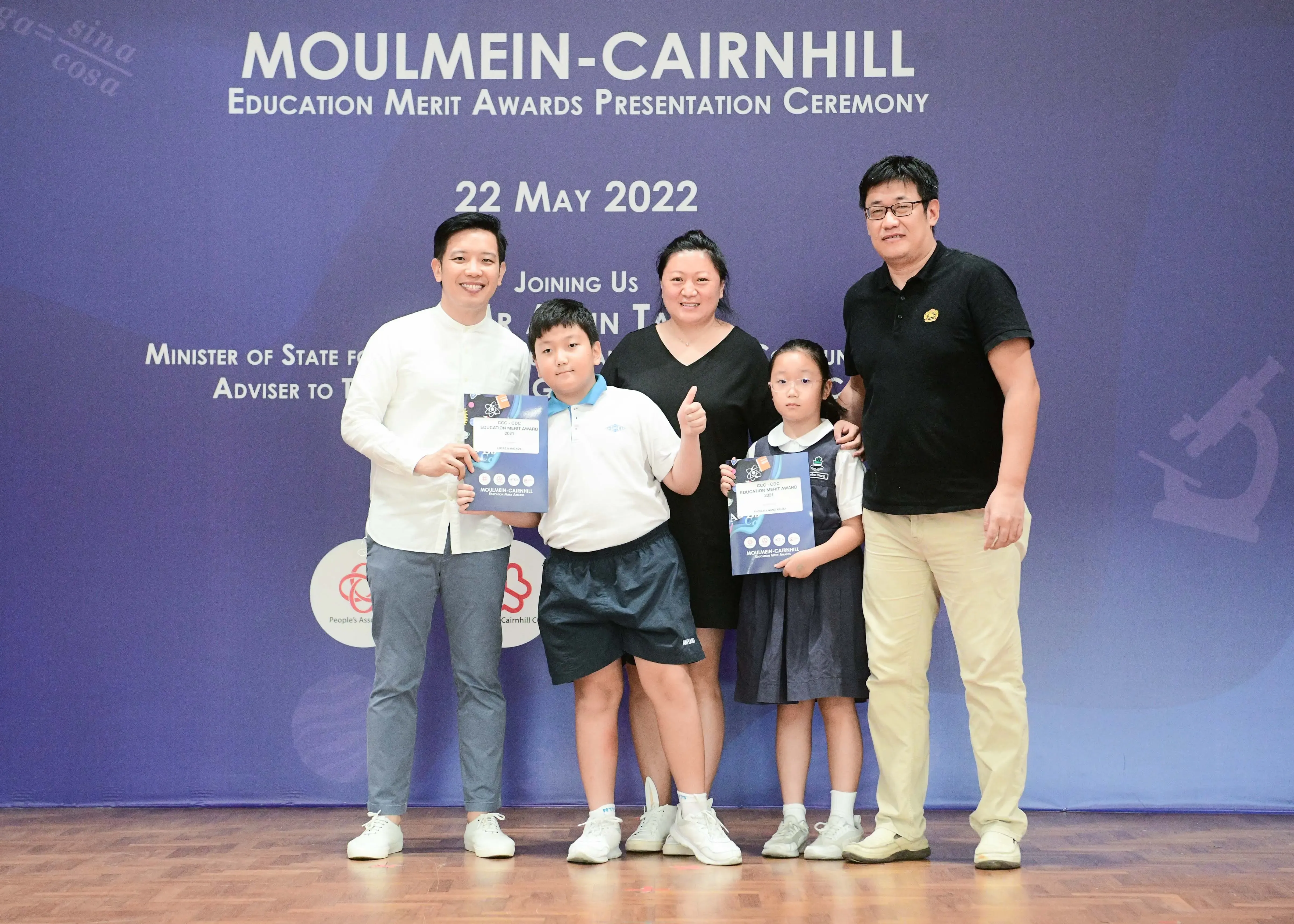 Five people pose at the Moulmein-Cairnhill Education Merit Awards Presentation Ceremony on 22 May 2022.