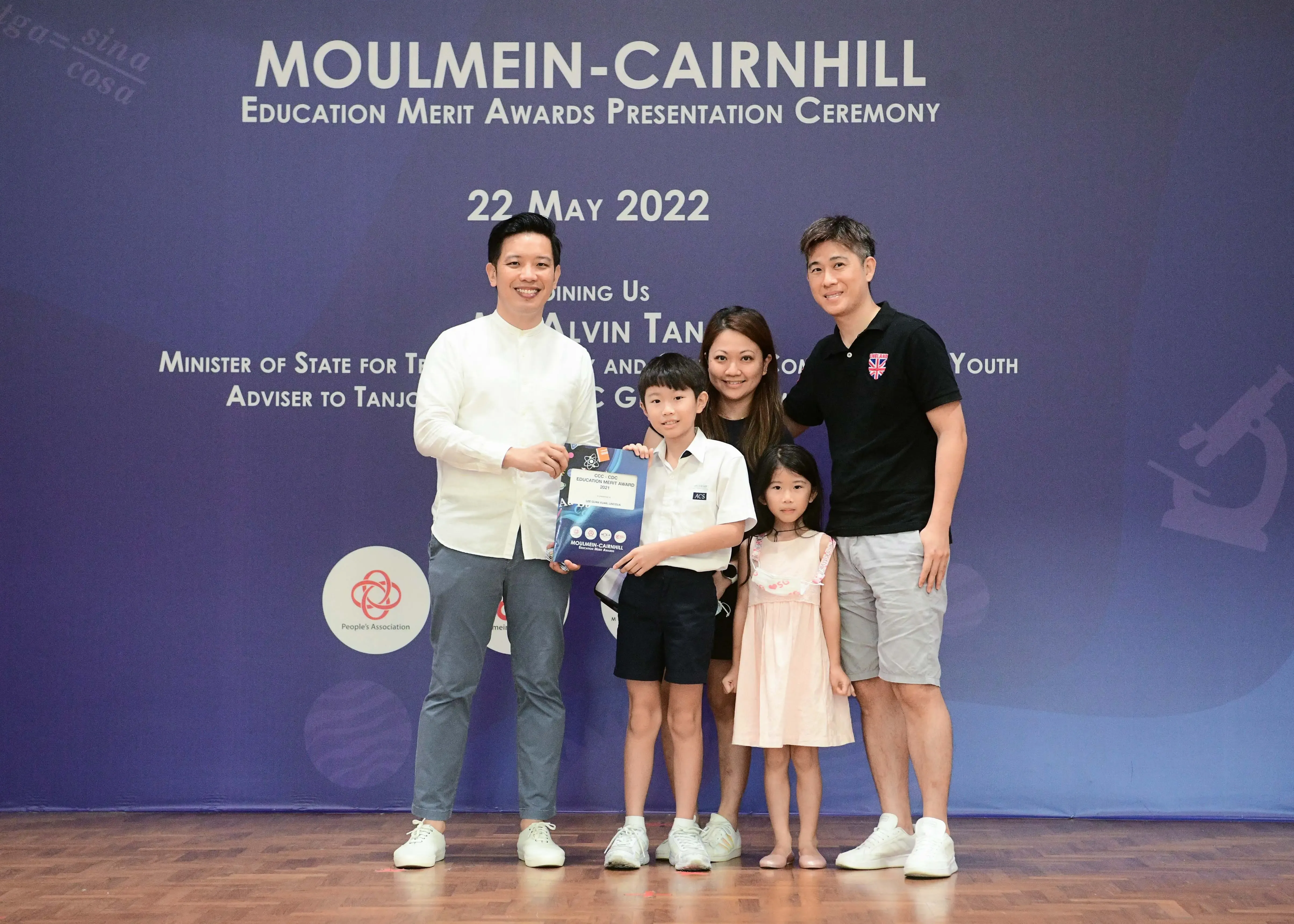 Five people pose at the Moulmein-Cairnhill Education Merit Awards Presentation Ceremony on 22 May 2022.