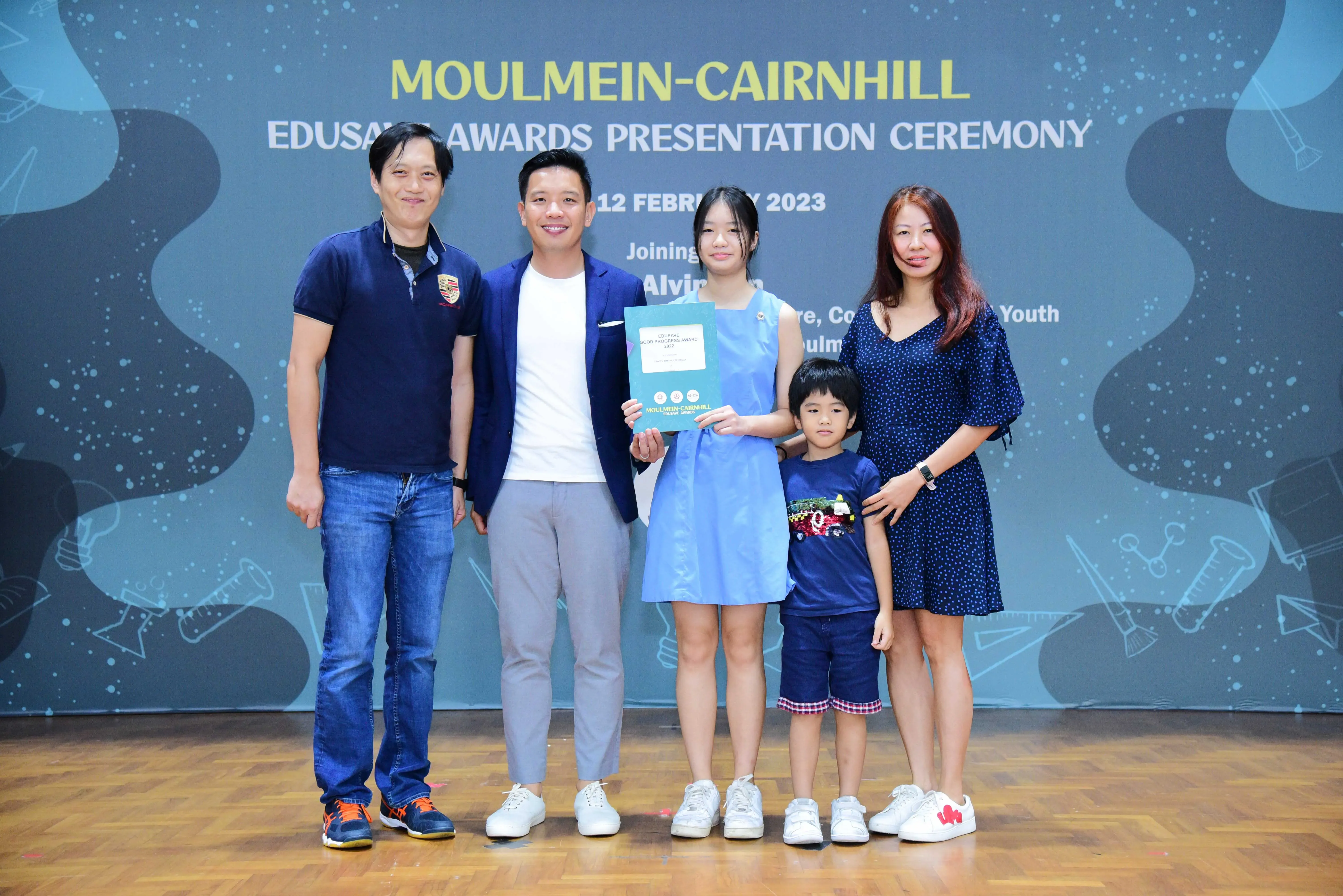 Five people pose at the Moulmein-Cairnhill Edusave Awards Presentation Ceremony on 12 February 2023.