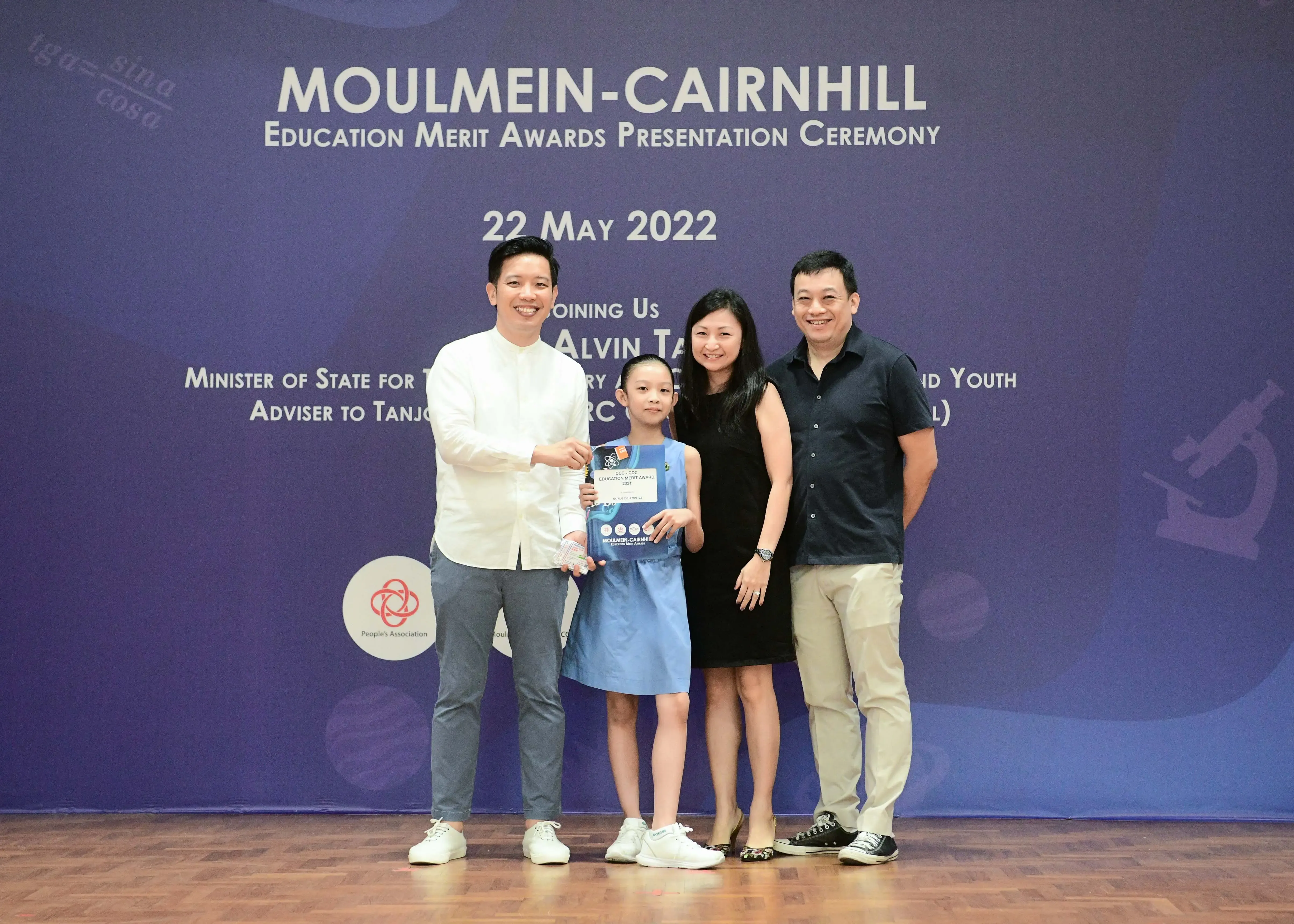 Four people pose at the Moulmein-Cairnhill Education Merit Awards Presentation Ceremony on 22 May 2022.