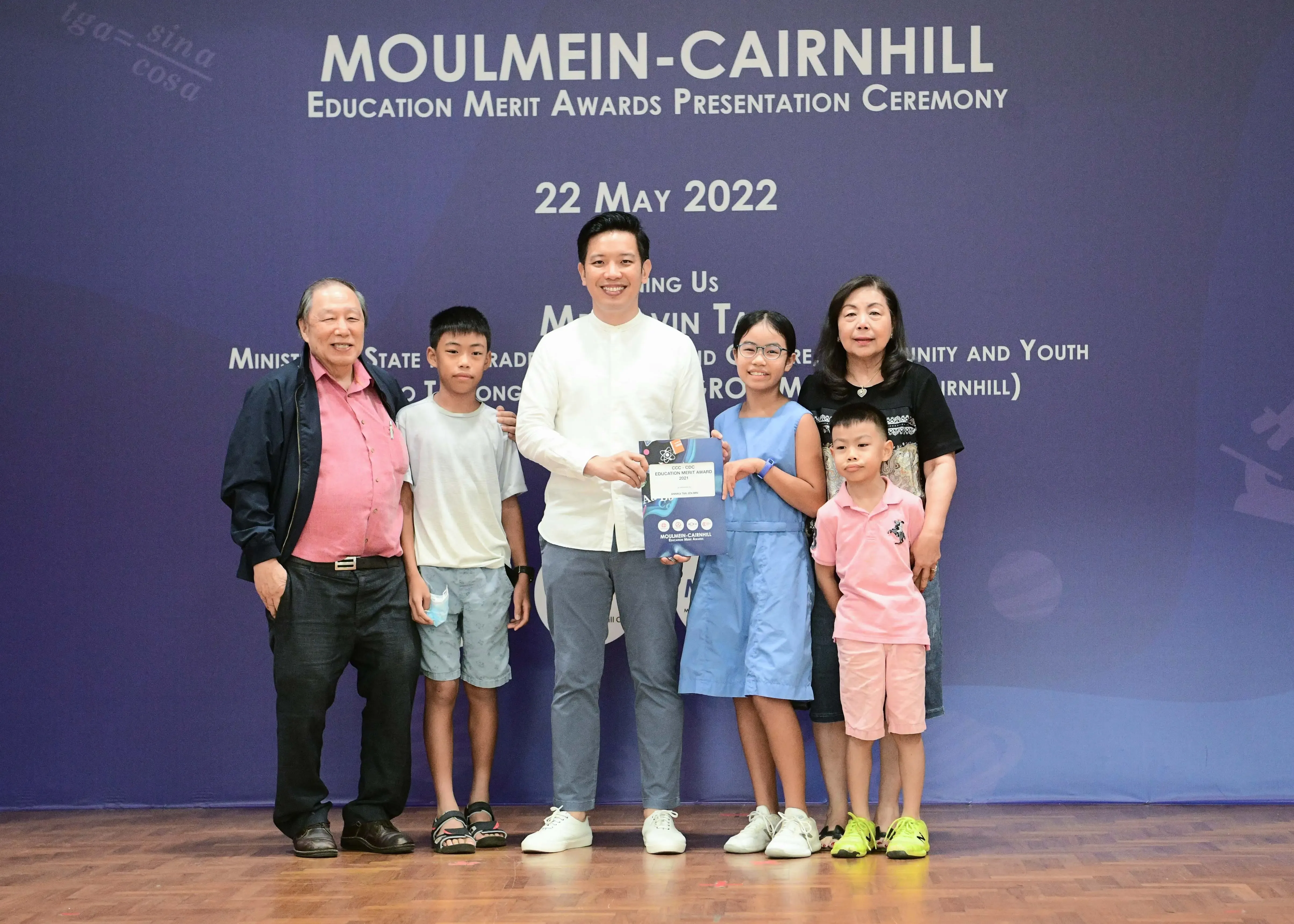 Six people pose at the Moulmein-Cairnhill Education Merit Awards Presentation Ceremony on 22 May 2022.