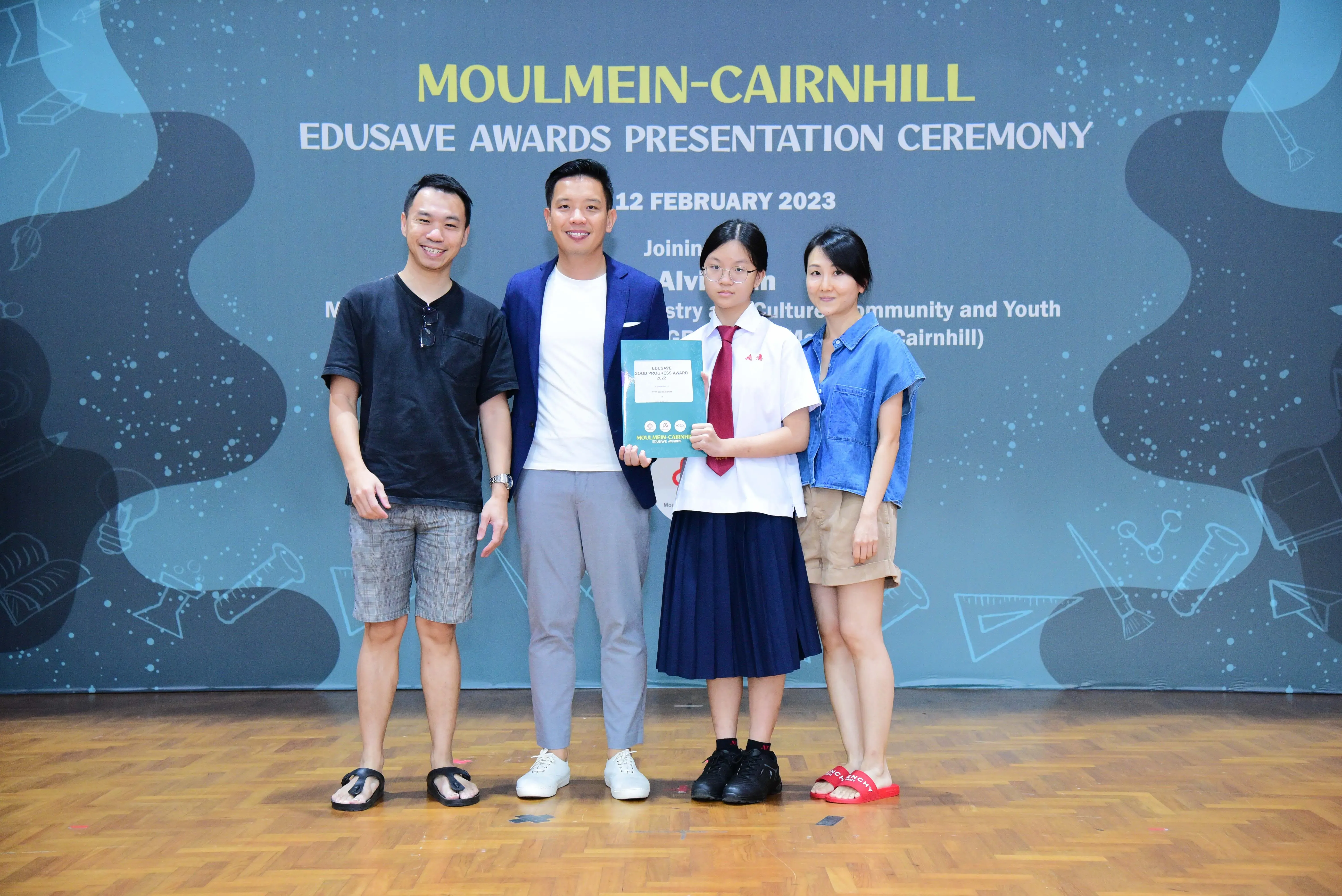 Four people pose at the Moulmein-Cairnhill Edusave Awards Presentation Ceremony on 12 February 2023.