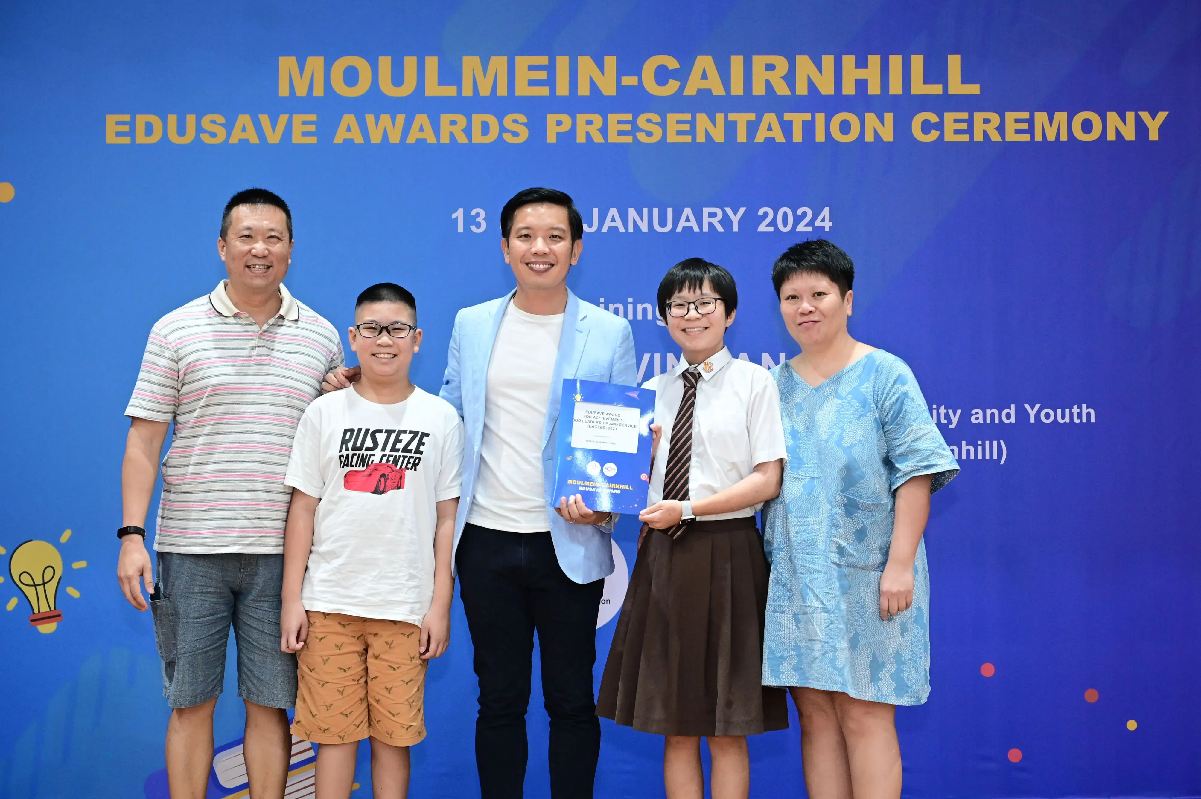 Five people pose at the Moulmein-Cairnhill Edusave Awards Presentation Ceremony on 13 January 2024.