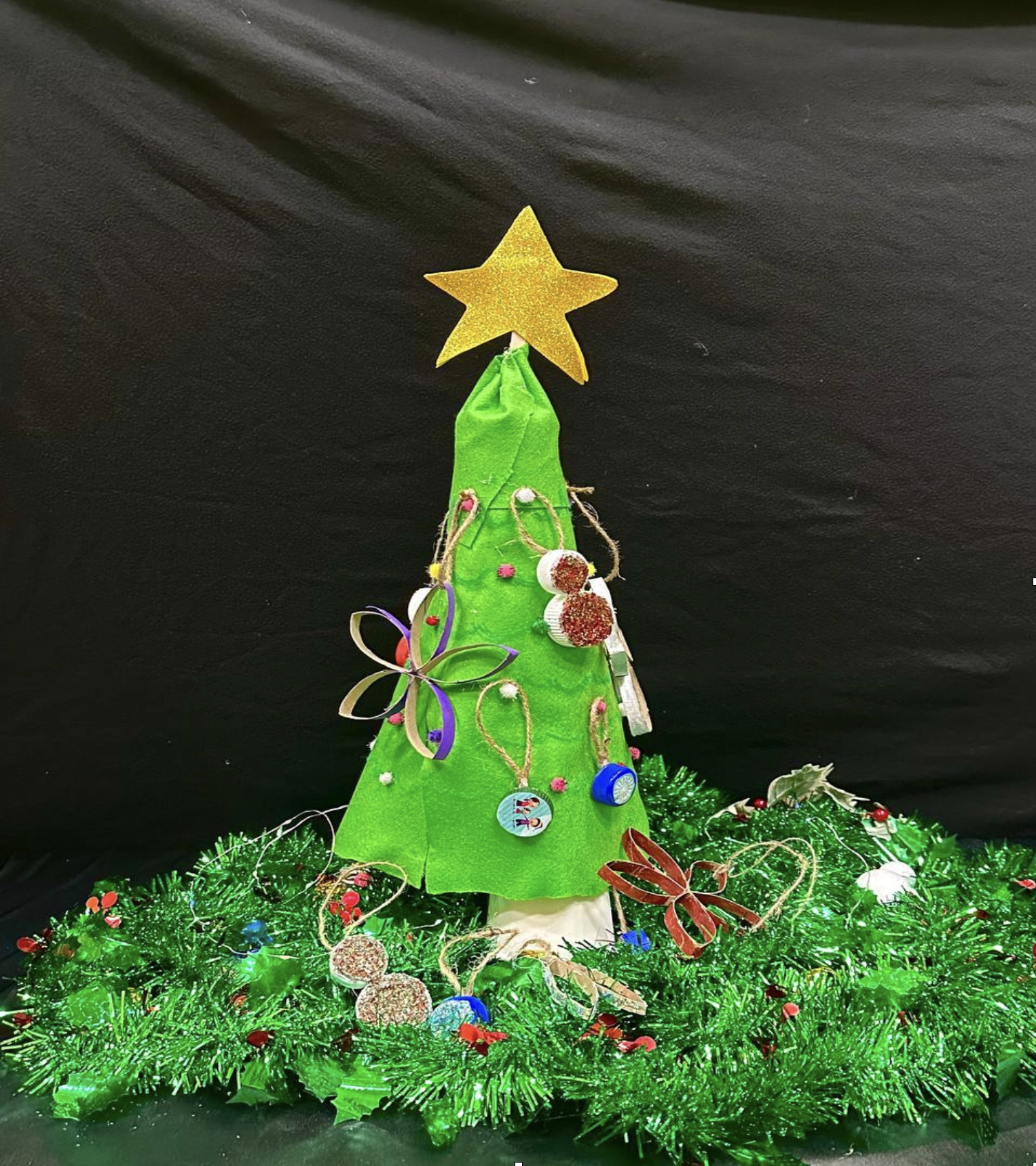 A small do-it-yourself christmas tree made out of fabric.