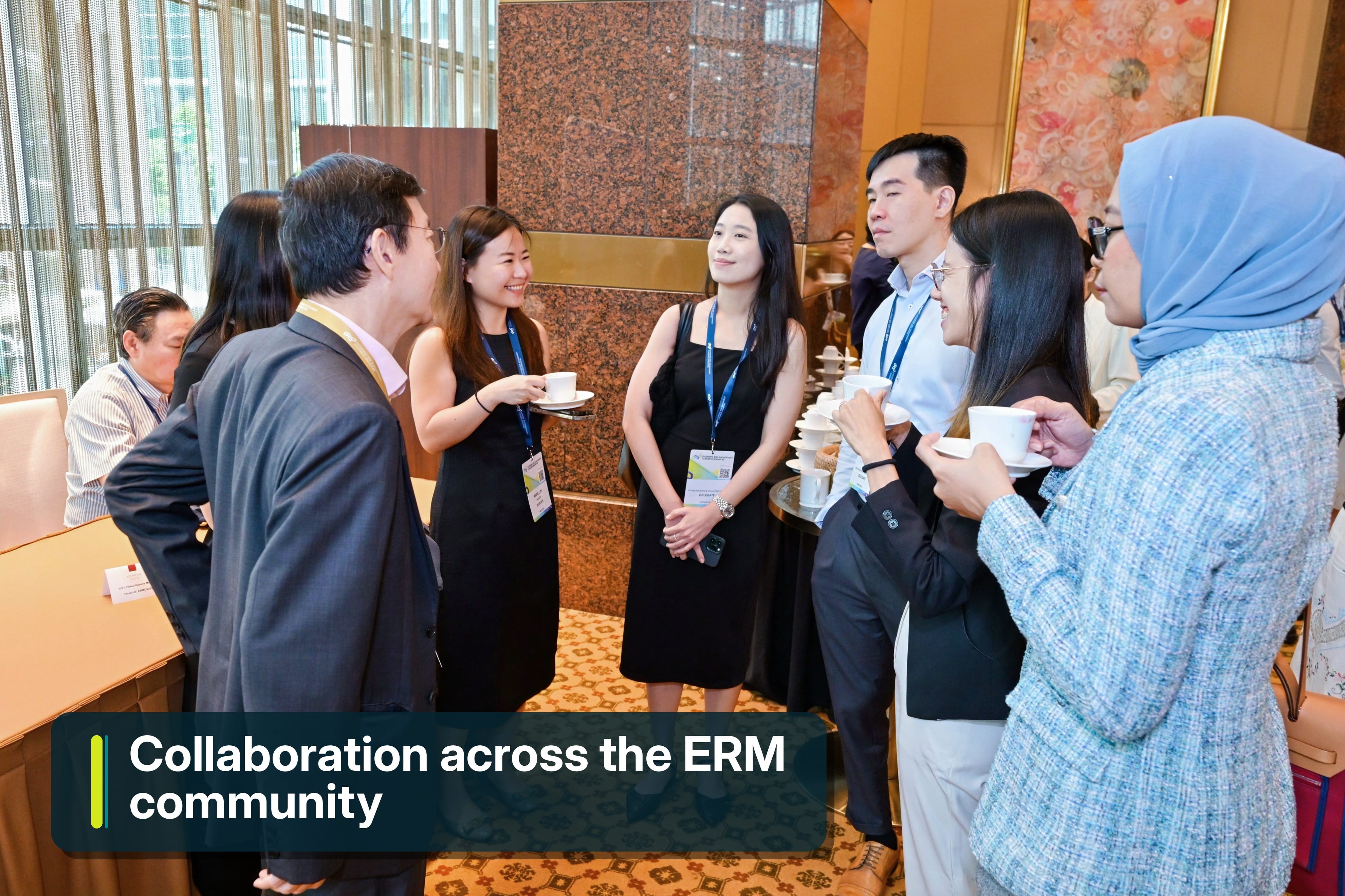 A group of delegates networking with each other during tea break session