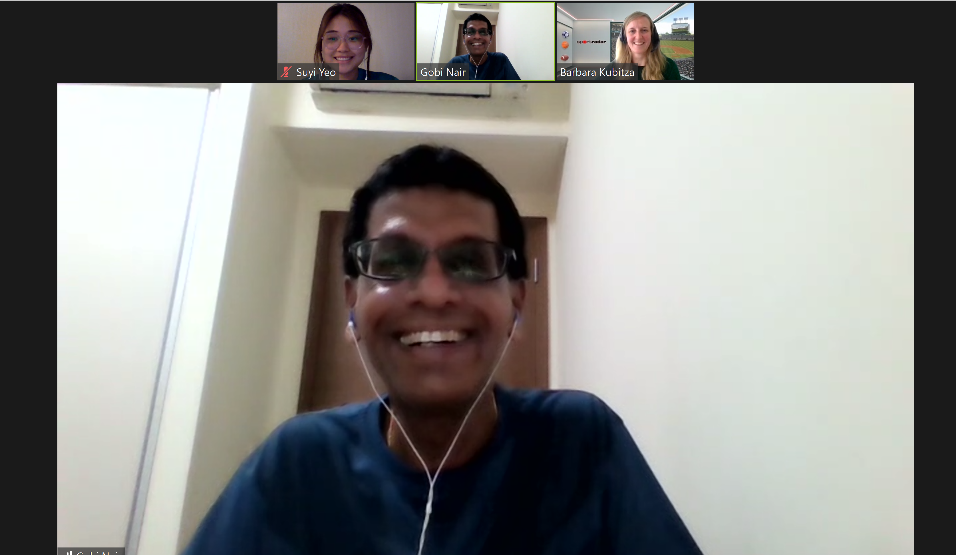 Video call with four participants: Gobi Nair smiling in main view, with Suyi Yeo, Gobi Nair, and Barbara Kubitza above.
