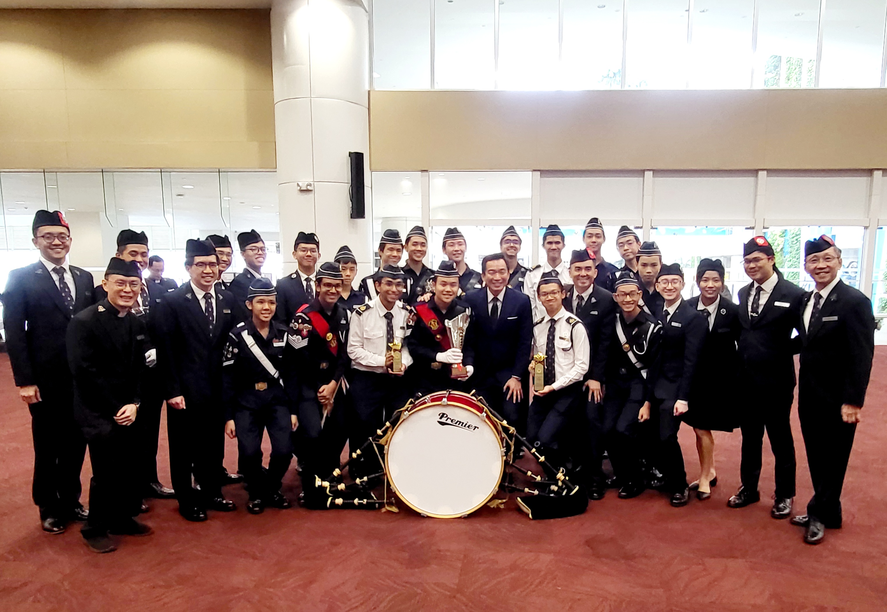 A group of BB band members posing in front of the ACS(I) spaceframe