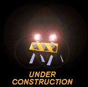 Yellow and black striped road barrier with two flashing lights and orange text reading UNDER CONSTRUCTION below it.