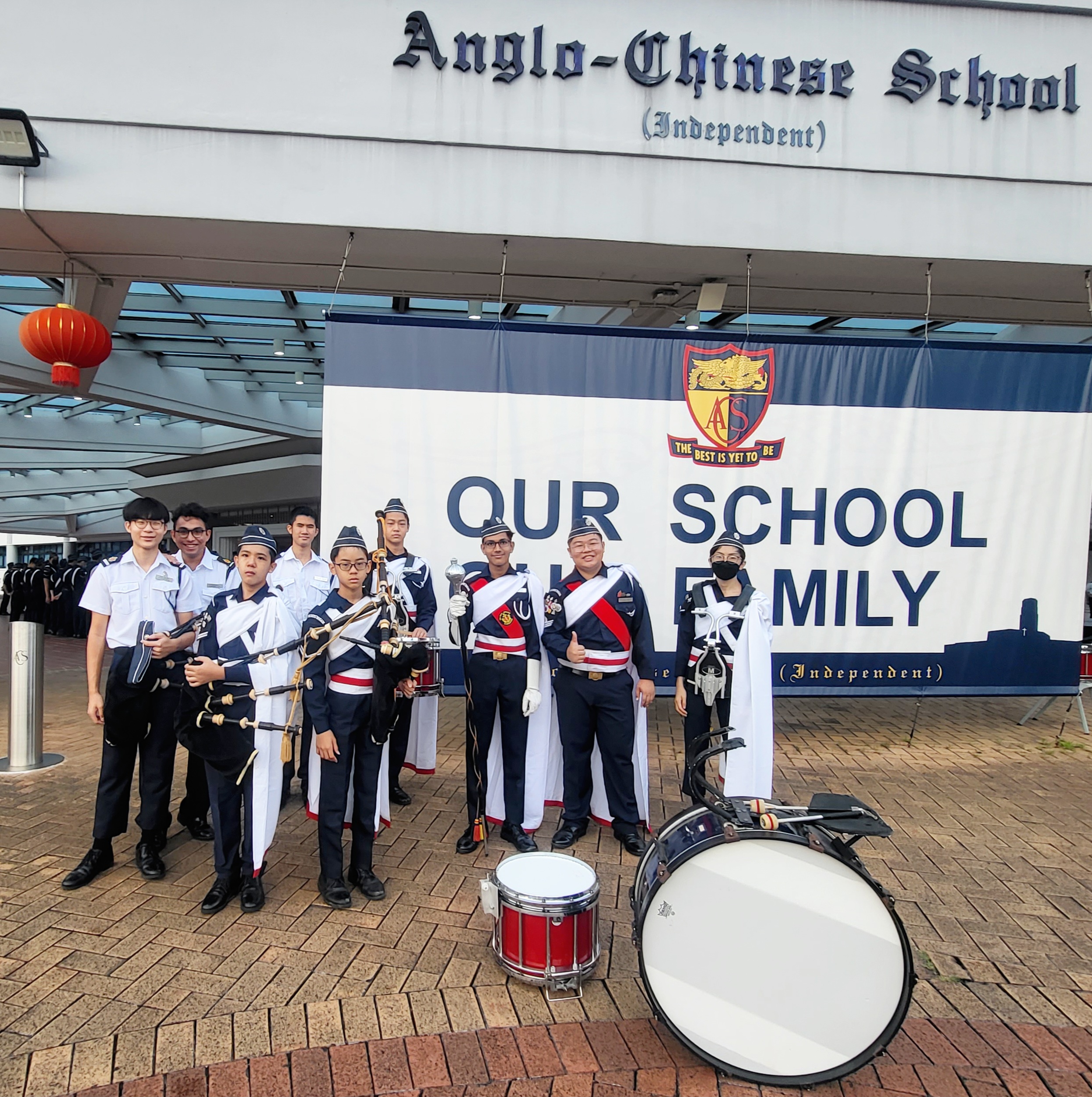 A group of BB band members posing in front of the ACS(I) Spaceframe