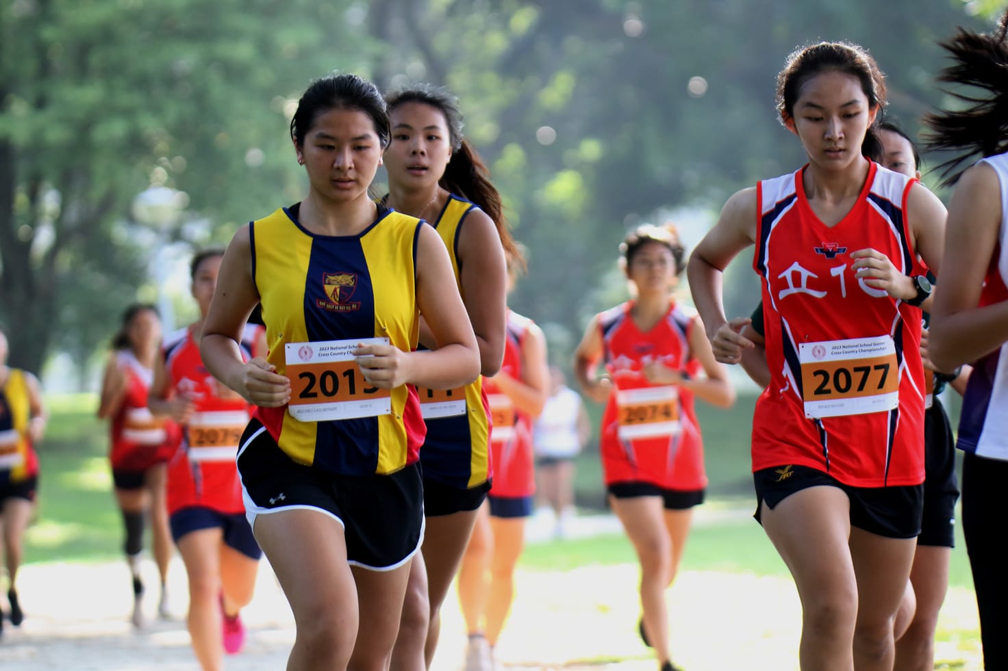 A group of young female runners mid run