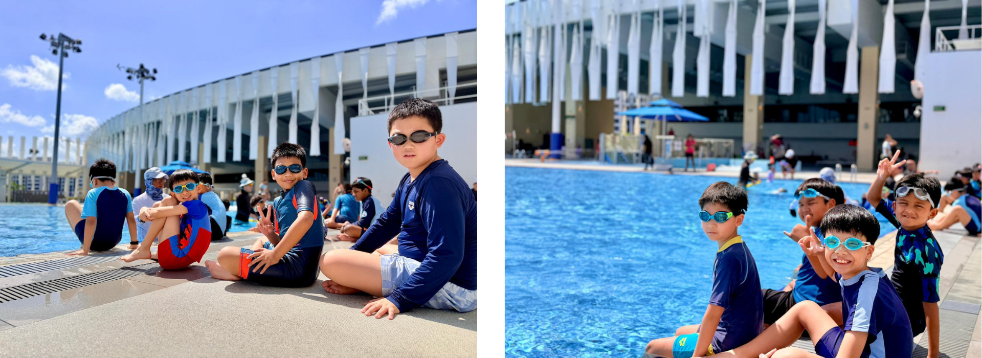 Children wearing swim goggles sit by a large outdoor pool beside a modern stadium on a sunny day.