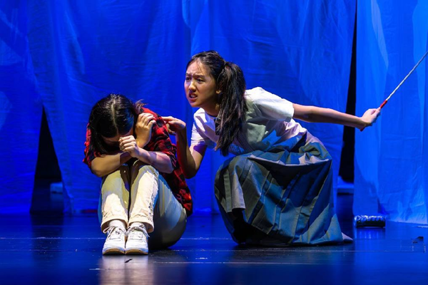 photo of 2 performers in a play
