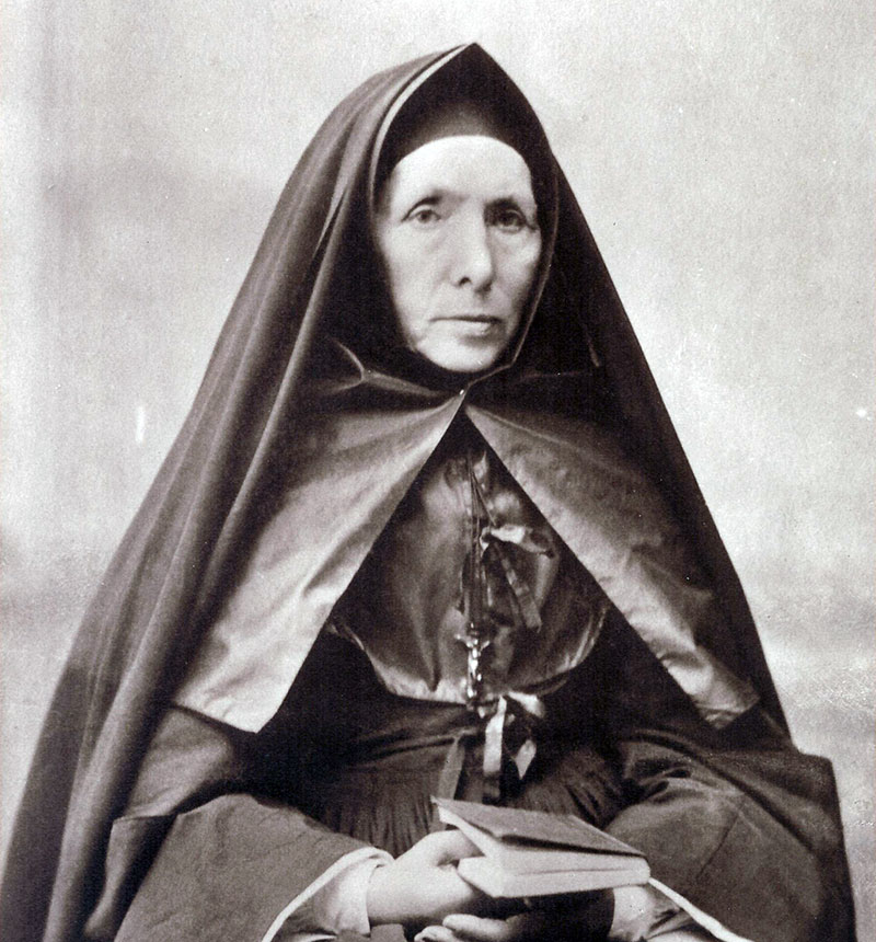 Black and white photo of Rev Mother St Mathilde Raclot wearing a dark nun's habit and veil.