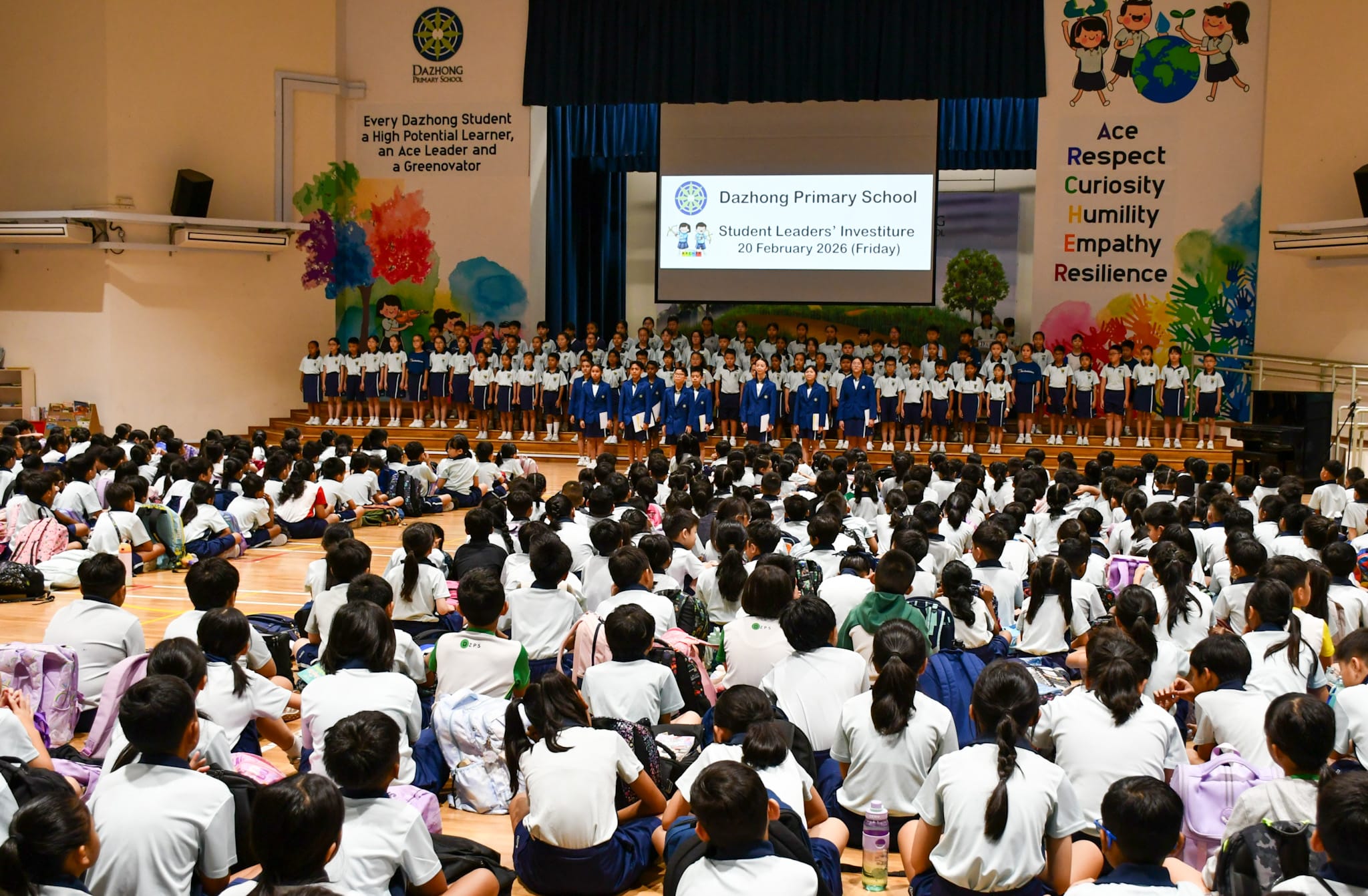 Dazhong Primary School students fill a hall for a Student Leaders Investiture ceremony on 20 February 2026.