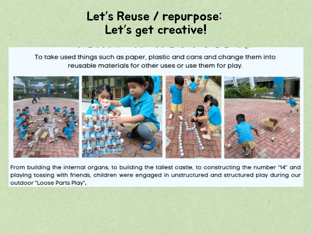 Children in blue shirts play outdoors using reused cans and cardboard in a loose parts play activity.