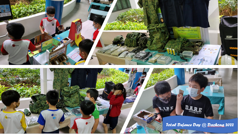 Children in school uniforms explore military gear and activity booths at Total Defence Day at Dazhong 2022.