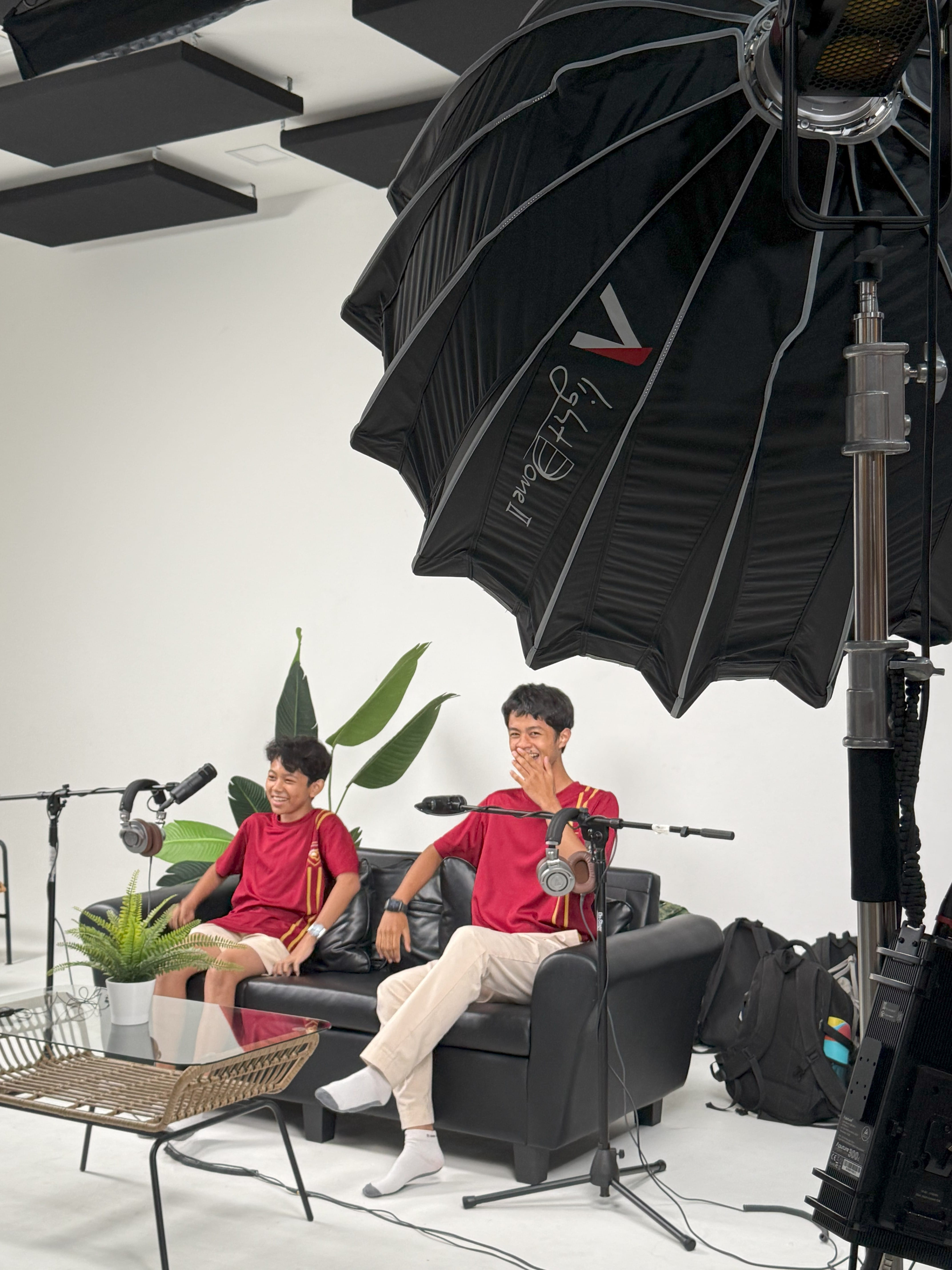 Two boys in a studio, different angle