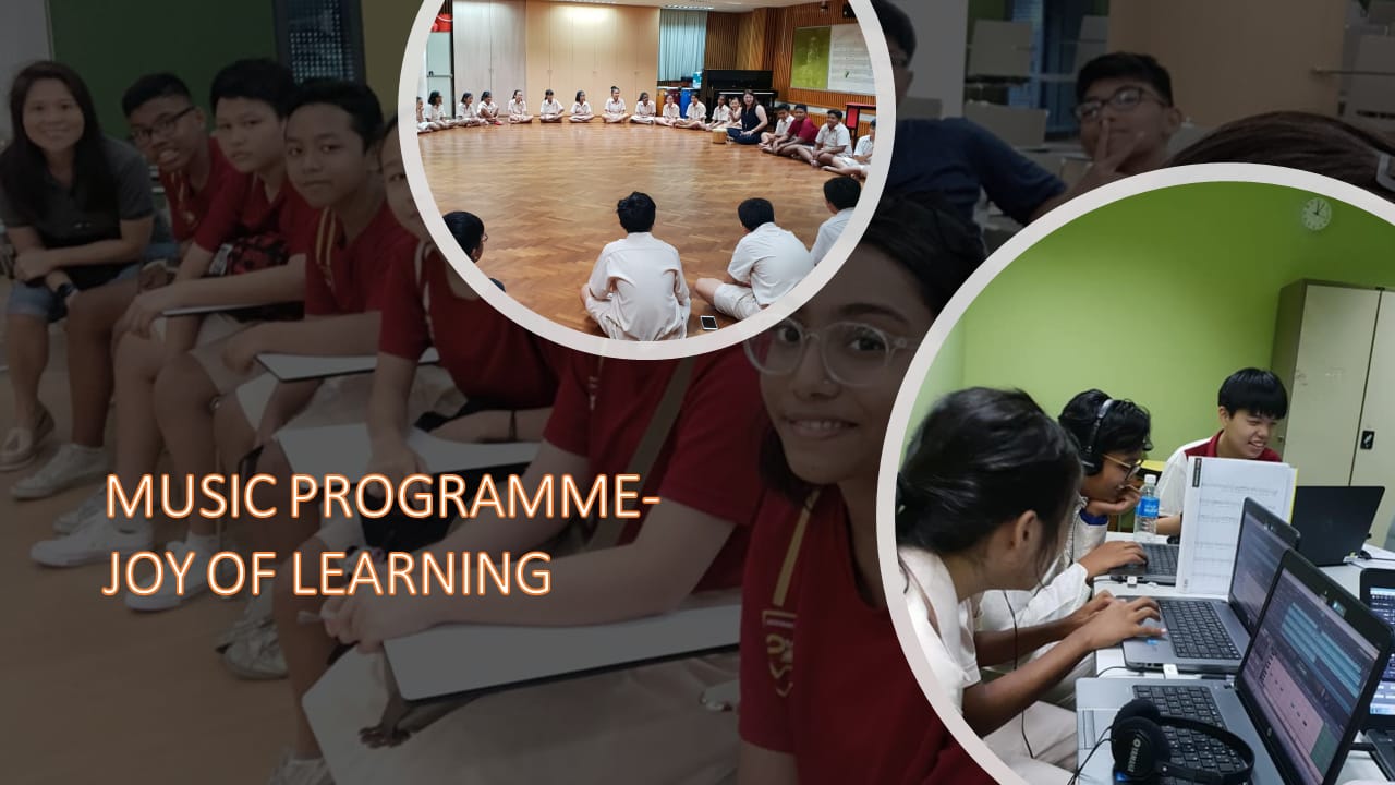 Students in a music programme sitting in a circle on a floor and working on laptops with headphones.