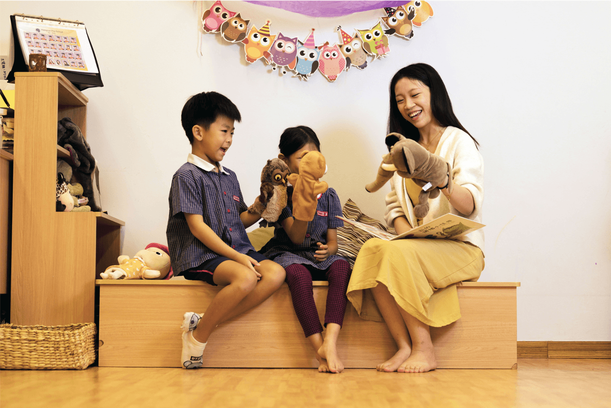 Children engaging in puppet play