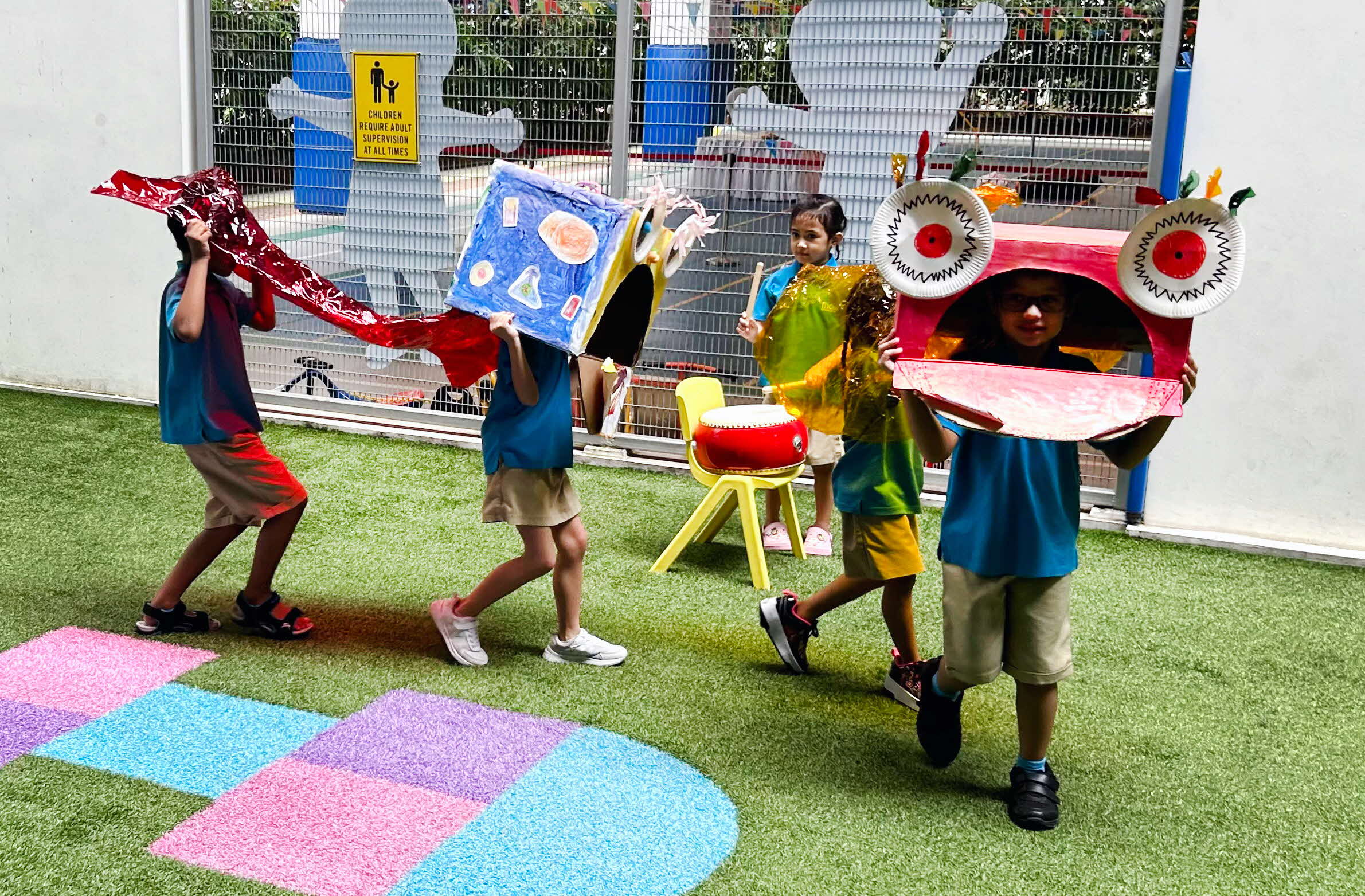 Children dancing with self-made props
