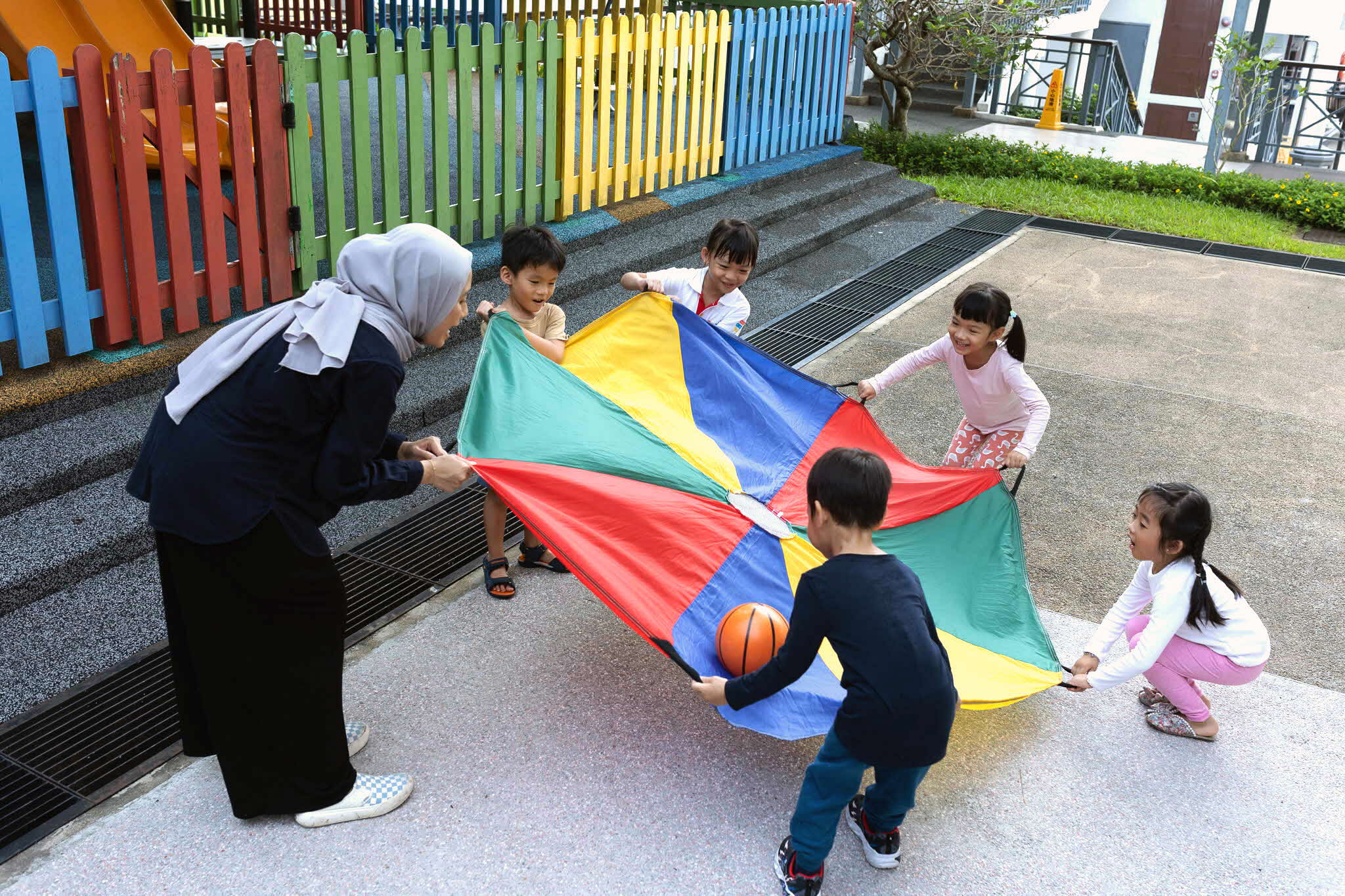 Children playing a parachute game