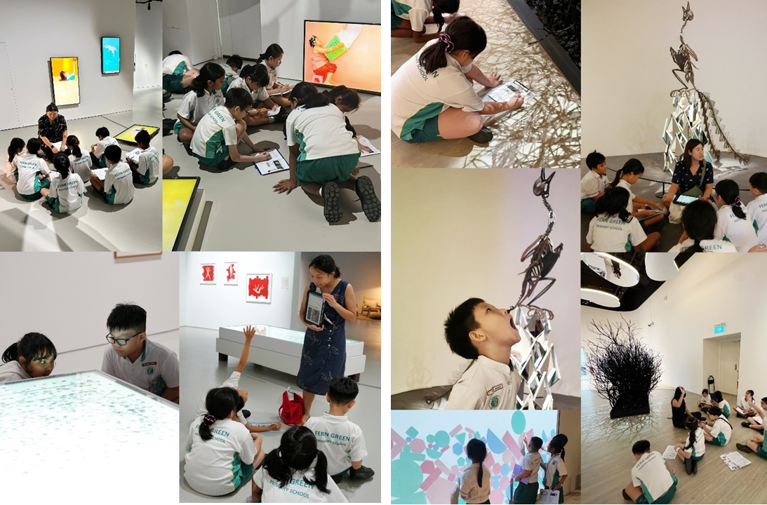 Primary school students in uniforms explore a modern art museum, viewing sculptures and interactive displays.