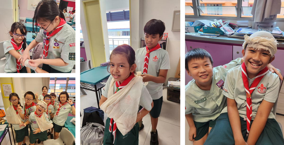 Children in scout uniforms practice first aid, applying bandages and slings on each other in a classroom.